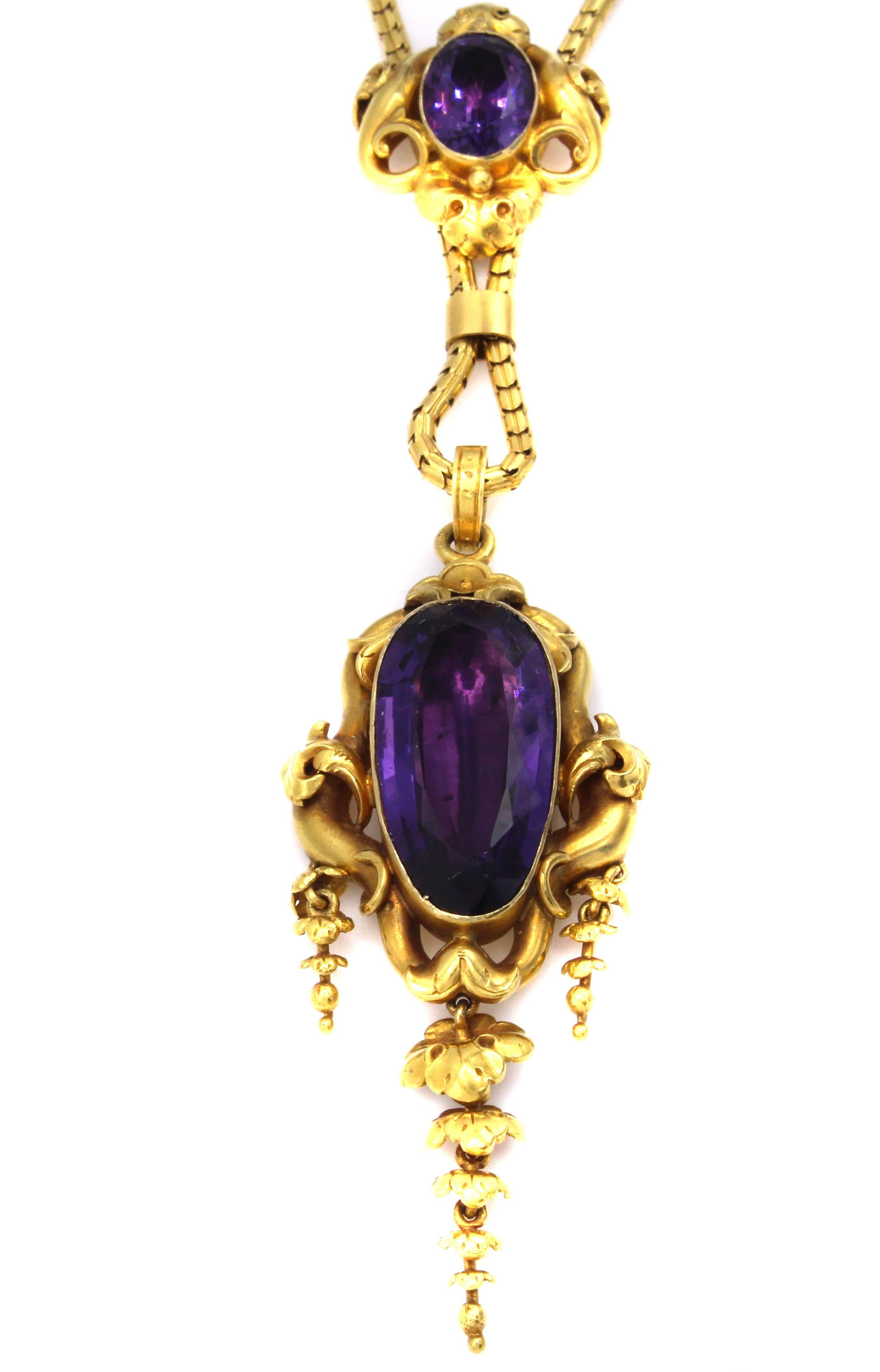Beautifully designed and amazingly well handcrafted this Victorian slide pendant necklace from ca 1875 is a true manifest to this romantic era. The pendant section of this necklace features a deep purple foiled back elongated amethyst measured to