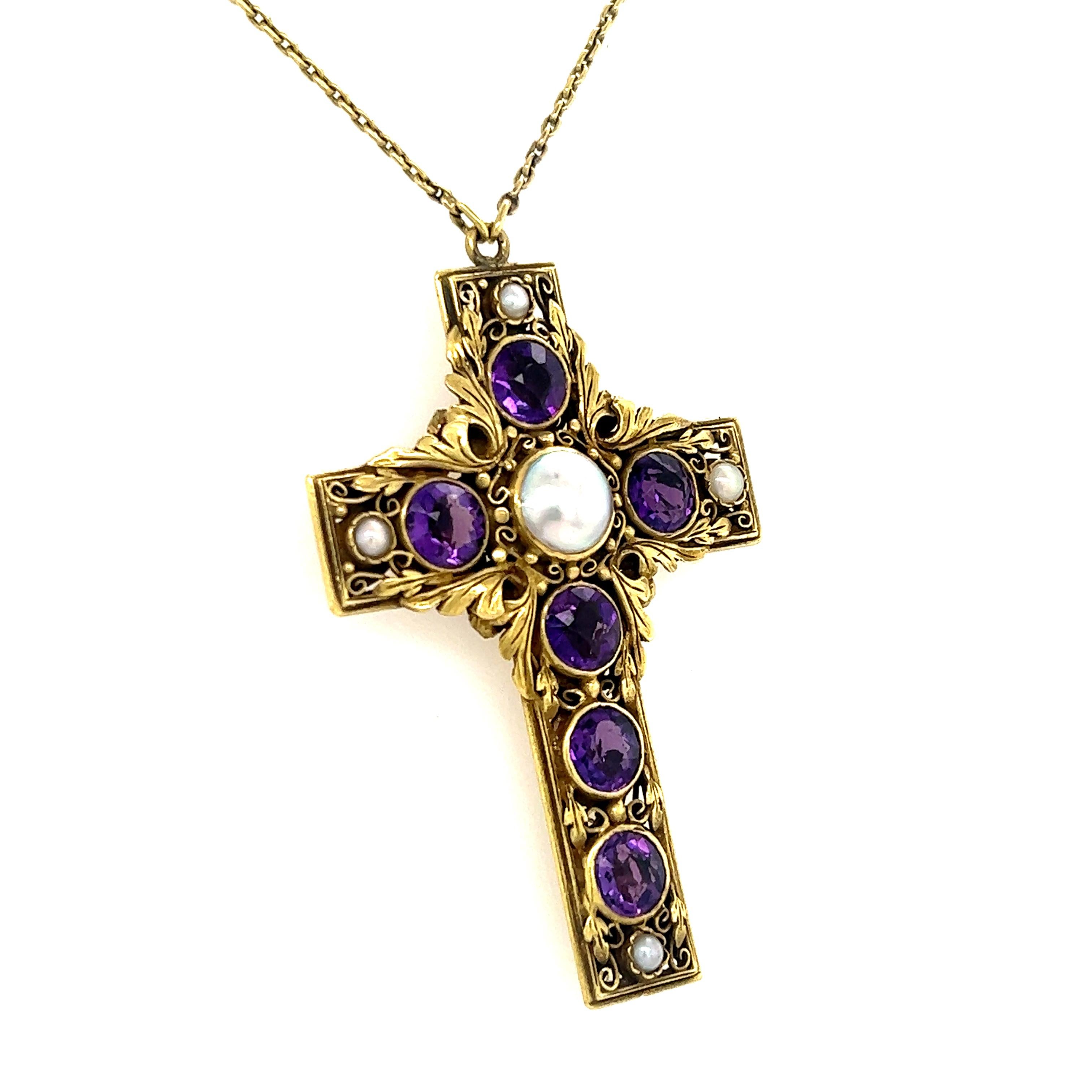A truly exceptional Victorian pendant and necklace. The piece is crafted in 14k yellow gold and showcases natural amethyst gemstones and natural pearl gemstones. The pendant shows details throughout as floral details are hand etched throughout the