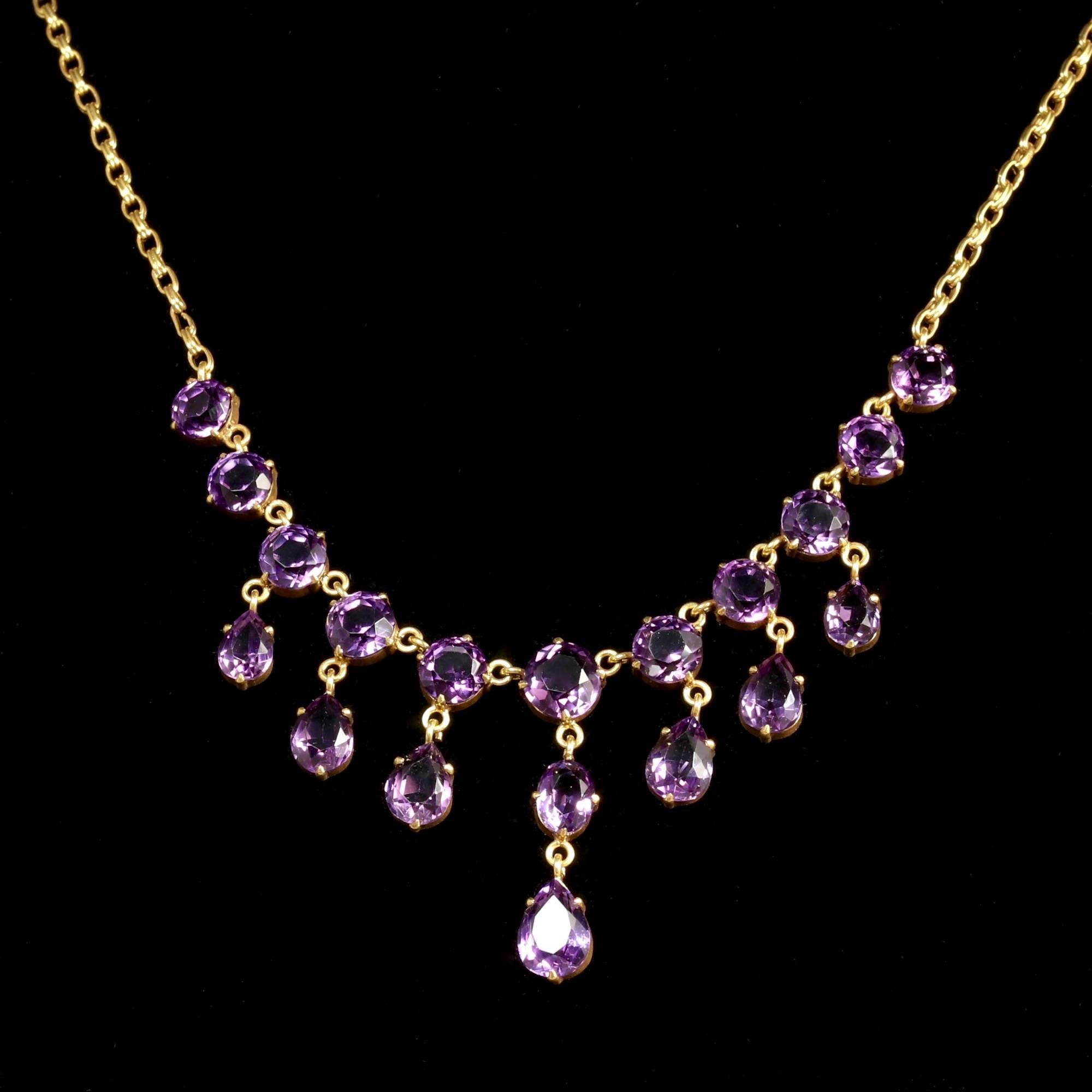 This spectacular Antique Victorian 18ct Gold on Silver Garland Amethyst necklace is Circa 1900.

Set with breathtaking rich purple Amethysts that compliment the necklace superbly.

The necklace have seven pendant droppers.

The Purple Amethyst has