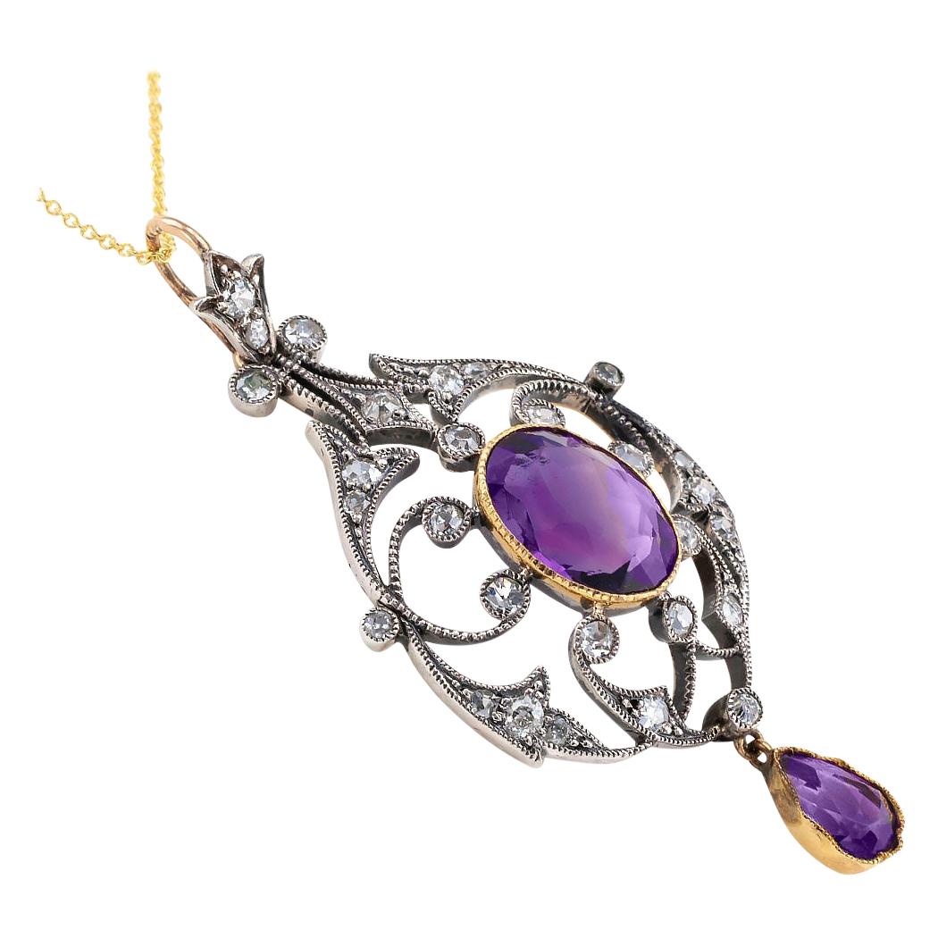 Victorian amethyst old mine-cut diamonds silver and gold pendant circa 1890.

DETAILS:
DIAMONDS:  twenty-eight old mine-cut diamonds totaling approximately 0.90 carat, approximately I – K color and SI – I clarity.
GEMSTONES:  two amethyst, one oval;