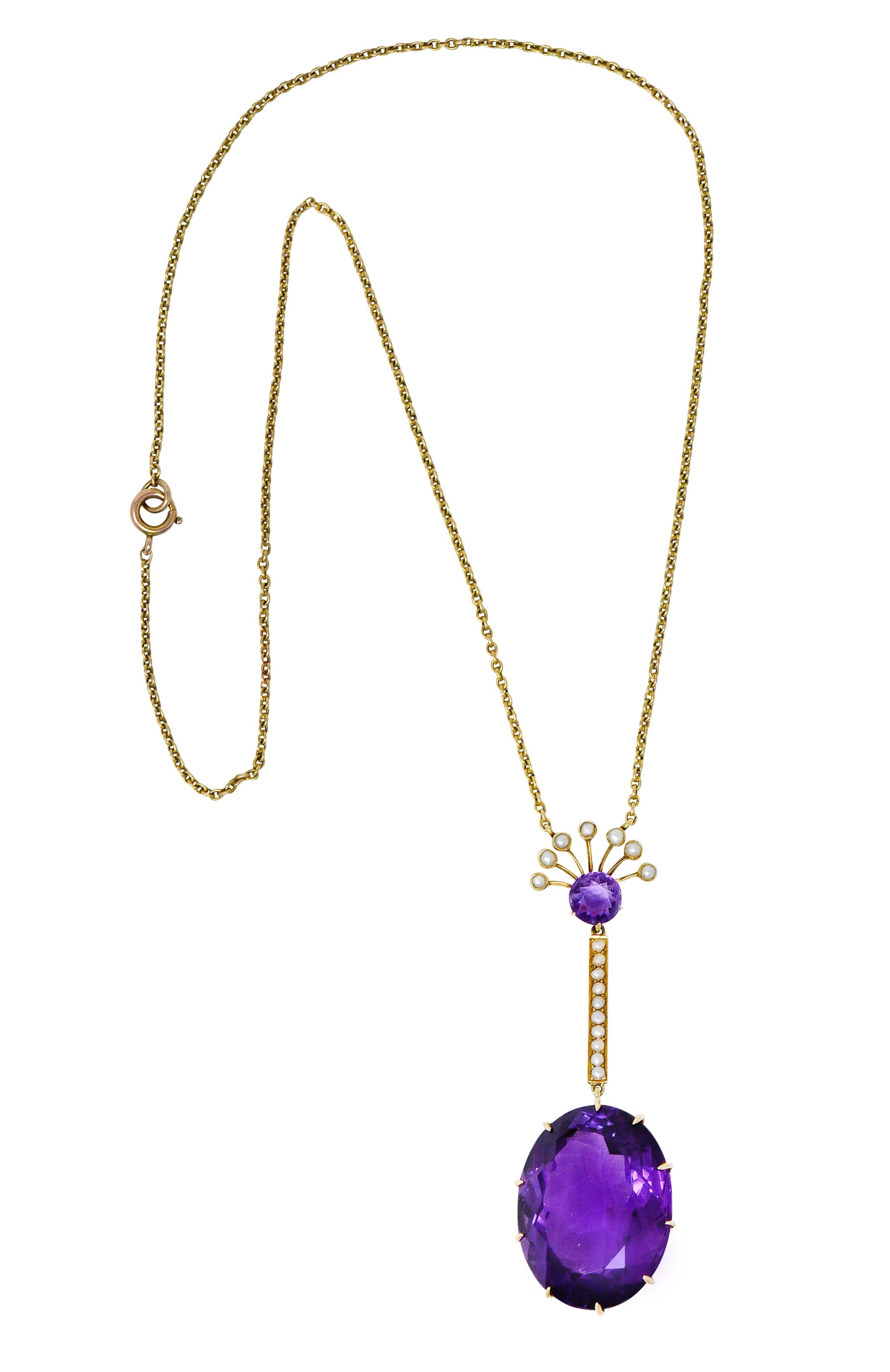 Cable chain necklace features an elongated drop

Surmount is a 7.0 mm round cut amethyst with a fanned motif accented by 2.0 mm pearls

Suspending a streamlined bar bead set with additional 1.5 mm natural freshwater pearls; all