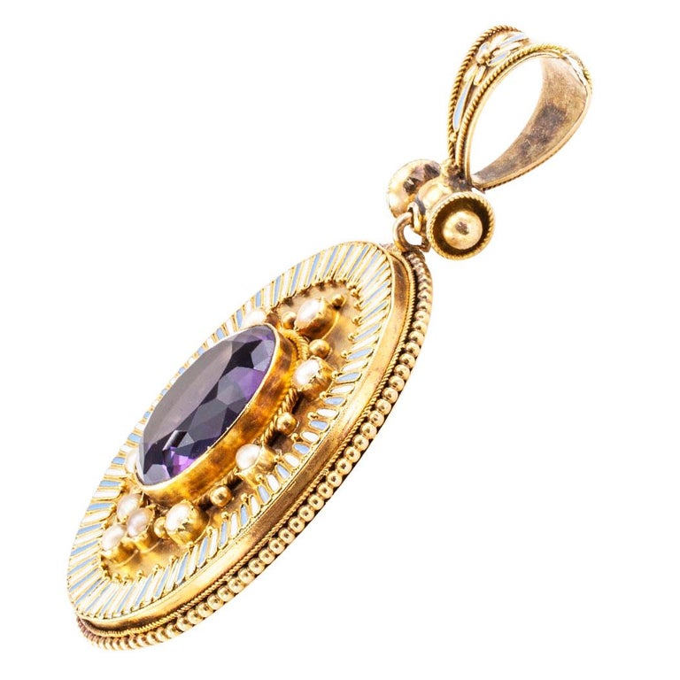 Victorian amethyst enamel pearl and gold pendant circa 1880. The design centers upon an oval amethyst bordered by small pearls, gold beads and a radiating motif comprising alternating strokes of pale blue and white enamel to a stepped edge of corded
