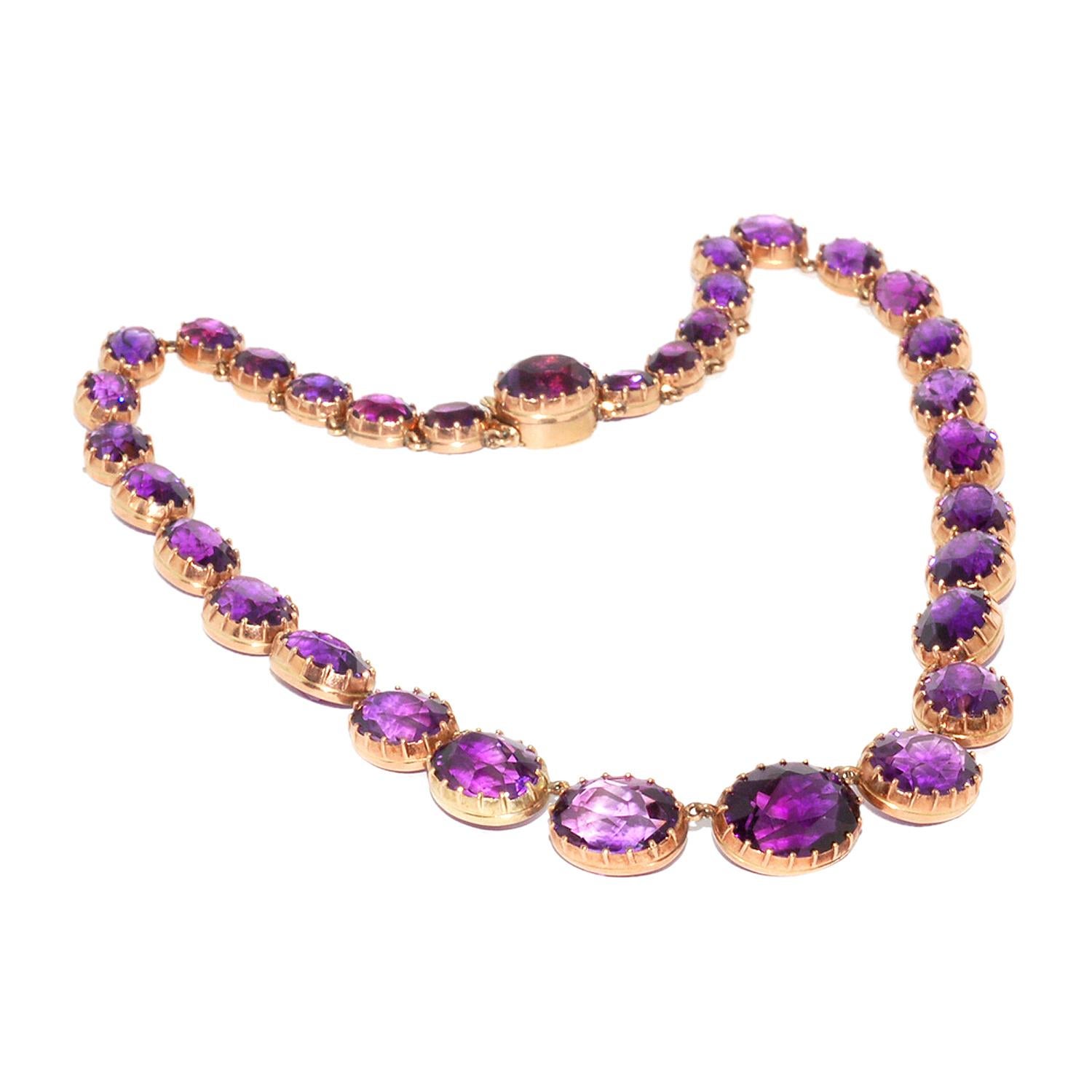 Victorian Amethyst Riviere Necklace

This exquisite Victorian amethyst riviere necklace is designed as a graduated series of oval-cut amethyst stones, each set in 15k rose gold.  A bright, classic design that is easy to wear and an excellent choice