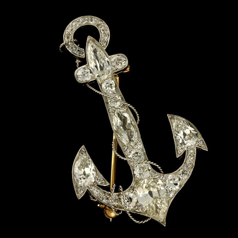 Round and pear-shaped old cut diamonds and single cut diamonds estimated to weigh a combined total of approximately 4cts.
Silver on gold
4.6cm long and 2.7cm wide
7.5 grams

A beautiful Victorian diamond-set anchor brooch/pendant c.1880, set