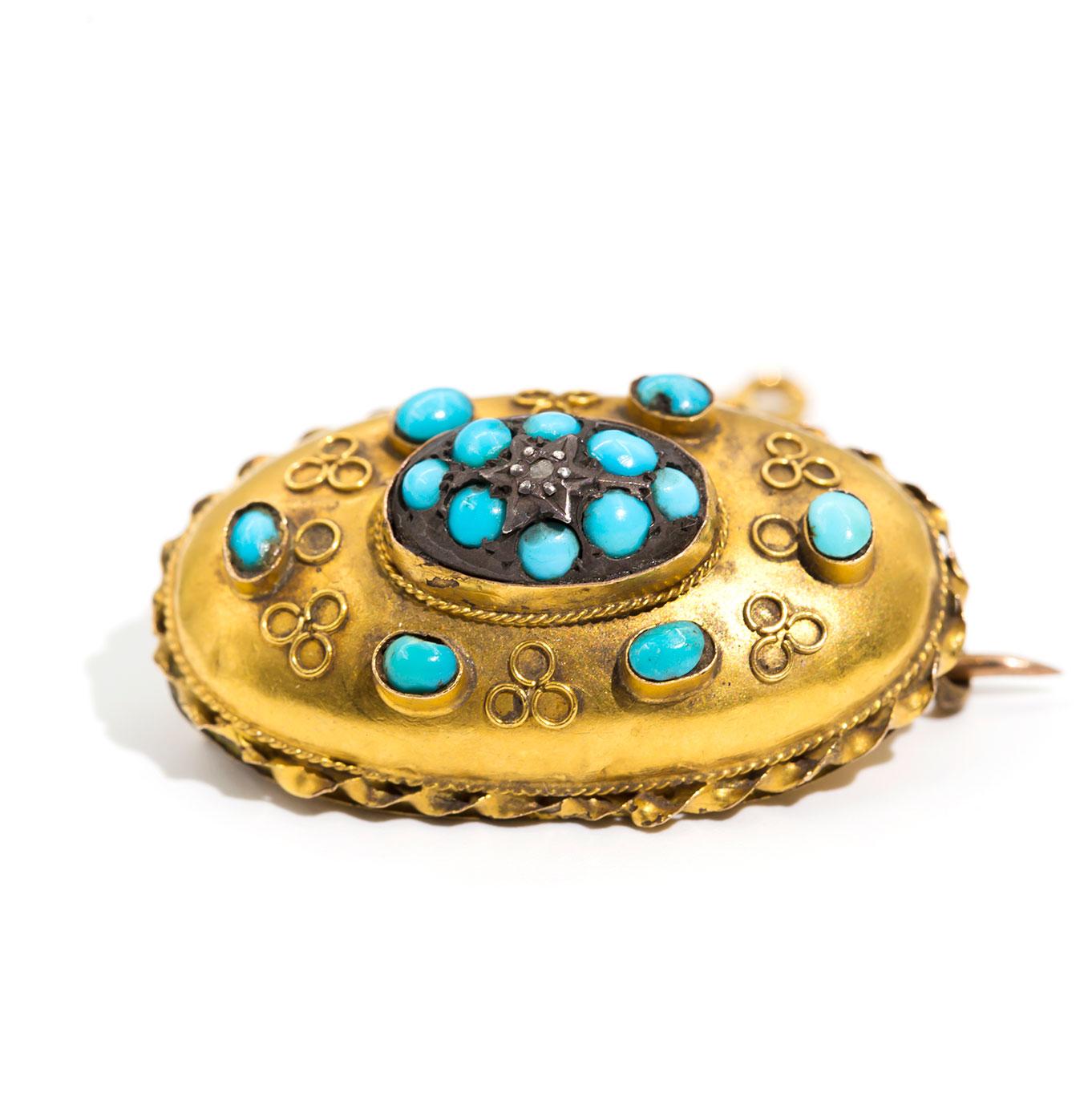 Carefully crafted in 15 carat yellow gold, this antique 19th-century Victorian mourning brooch is a typically beautiful piece from its era, featuring one central diamond and fourteen oval and round Turquoise cabochons delicately set in a high dome