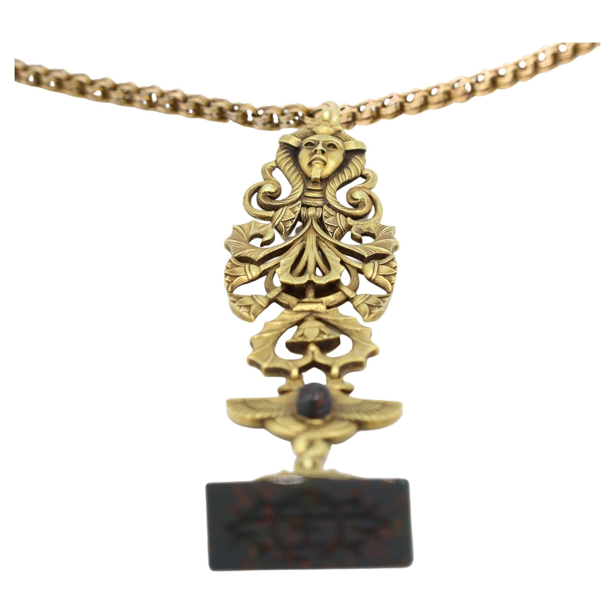 Gender: Ladies

Metal Type: 21K Yellow Gold 

Pendant Length: 4.50 inches

Chain Length: 21.00 inches

Chain Width 3.80 mm

Width: 25.50 mm

Pendant Weight: 36.80 grams

Chain Weight: 11.40 grams

One ladies 21K yellow gold heliotrope victorian