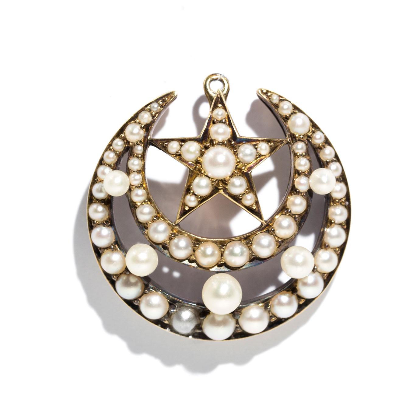 Carefully crafted in 15 carat yellow gold, this antique 19th century Victorian Star and Moon brooch. This charming antique brooch features five round white cultured pearls that are carefully set in the middle of the crescent moon, perched on top is