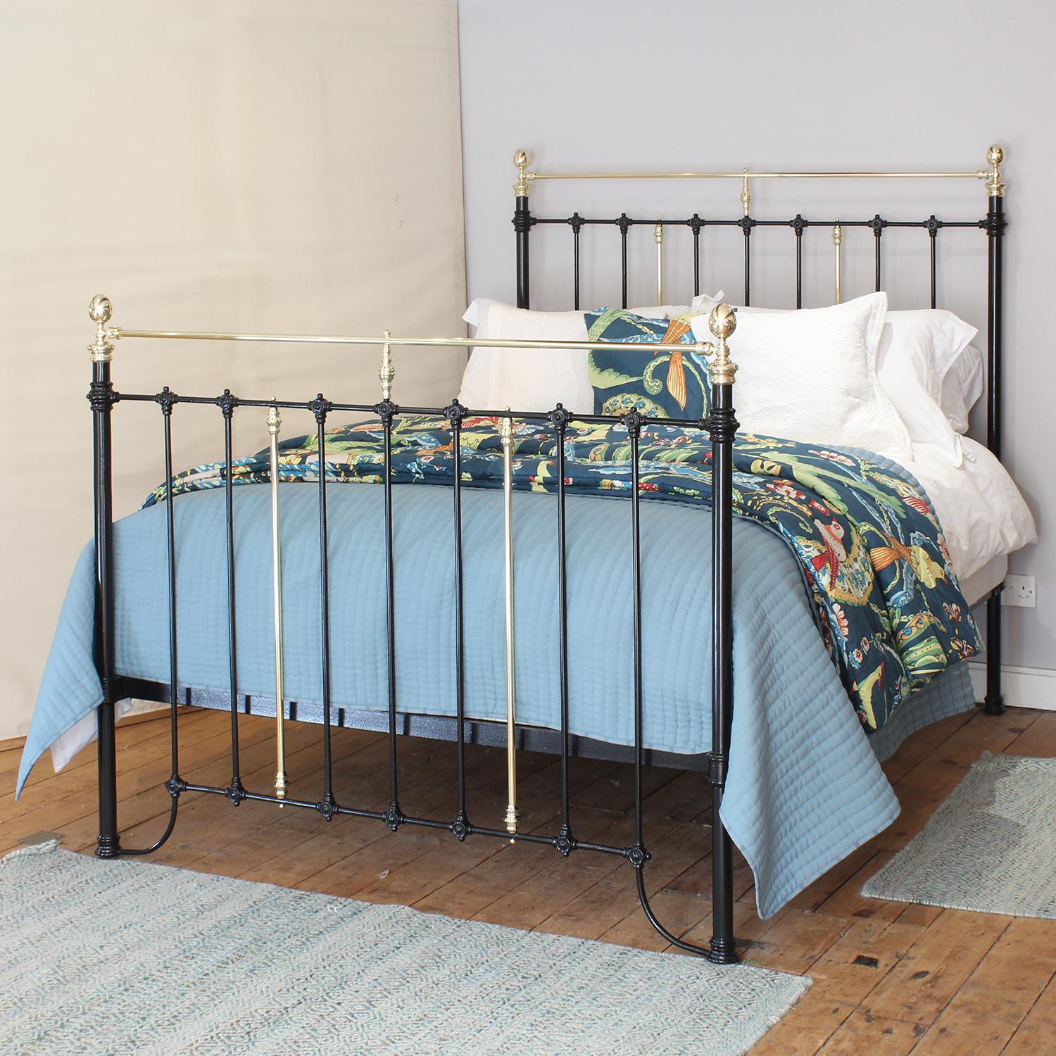 A fine example of a Victorian brass and iron bed finished in black with straight brass top rail and oval brass knobs.

This bed accepts a UK King or US Queen, 5ft or 60in wide, mattress and base.

The price also includes a firm bed base to support