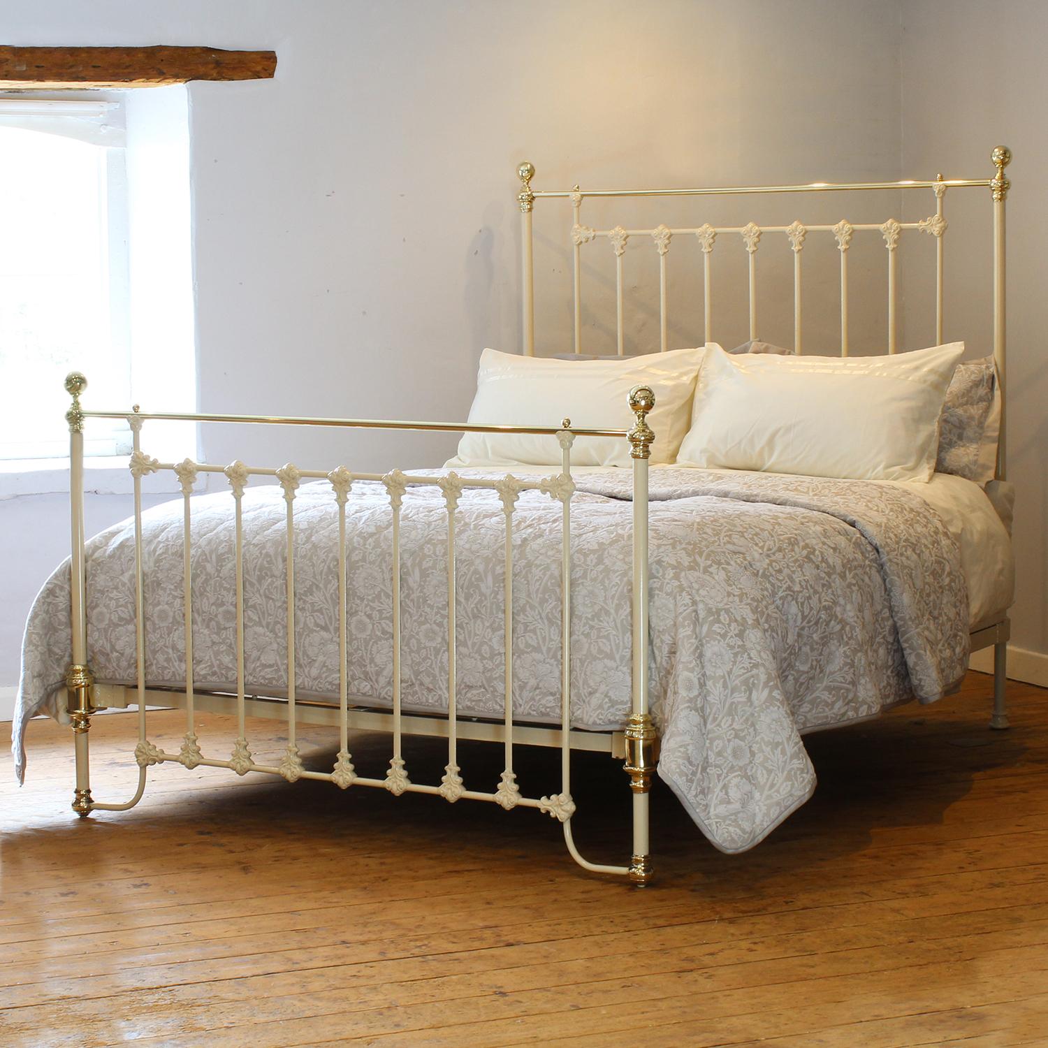 A fine example of a Victorian brass and iron bed finished in cream with large decorative and attractive castings, unusual oval bar panels, straight brass top rails, brass knobs, and brass kneecaps on the foot panel.

This bed accepts a UK King or US