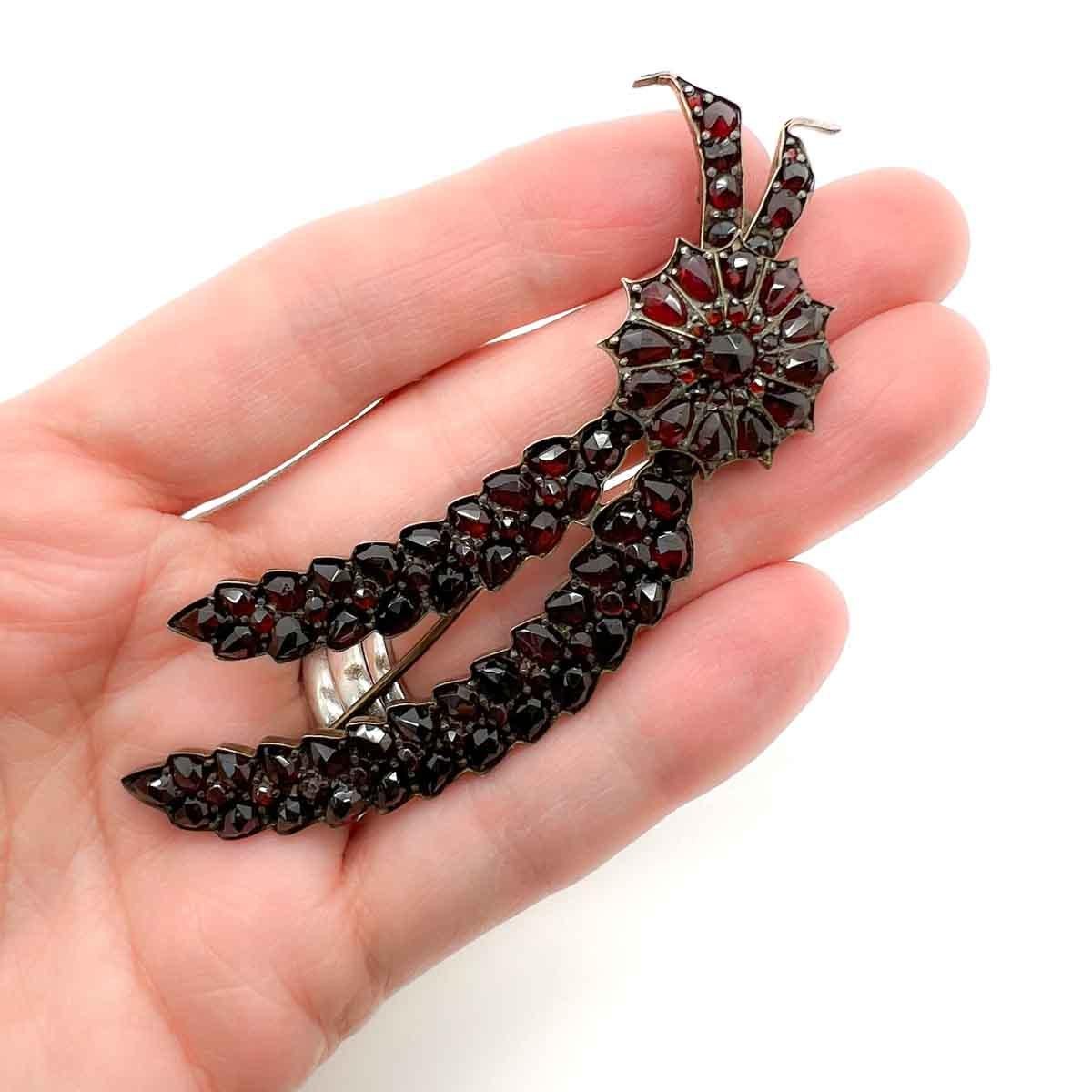 An original, Antique Bohemian Garnet Floral Spray from the late Victorian era, the 1880s. A large and delightful motif featuring a wheat sheaf pinned by a sunburst pave set with fancy rose cut stones. The variety of cuts creating a wonderful