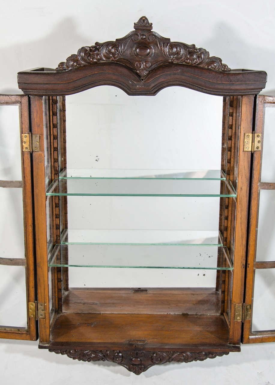 Late 19th Century Victorian Antique Curio Cabinet with Hand Carved Wood Designs For Sale