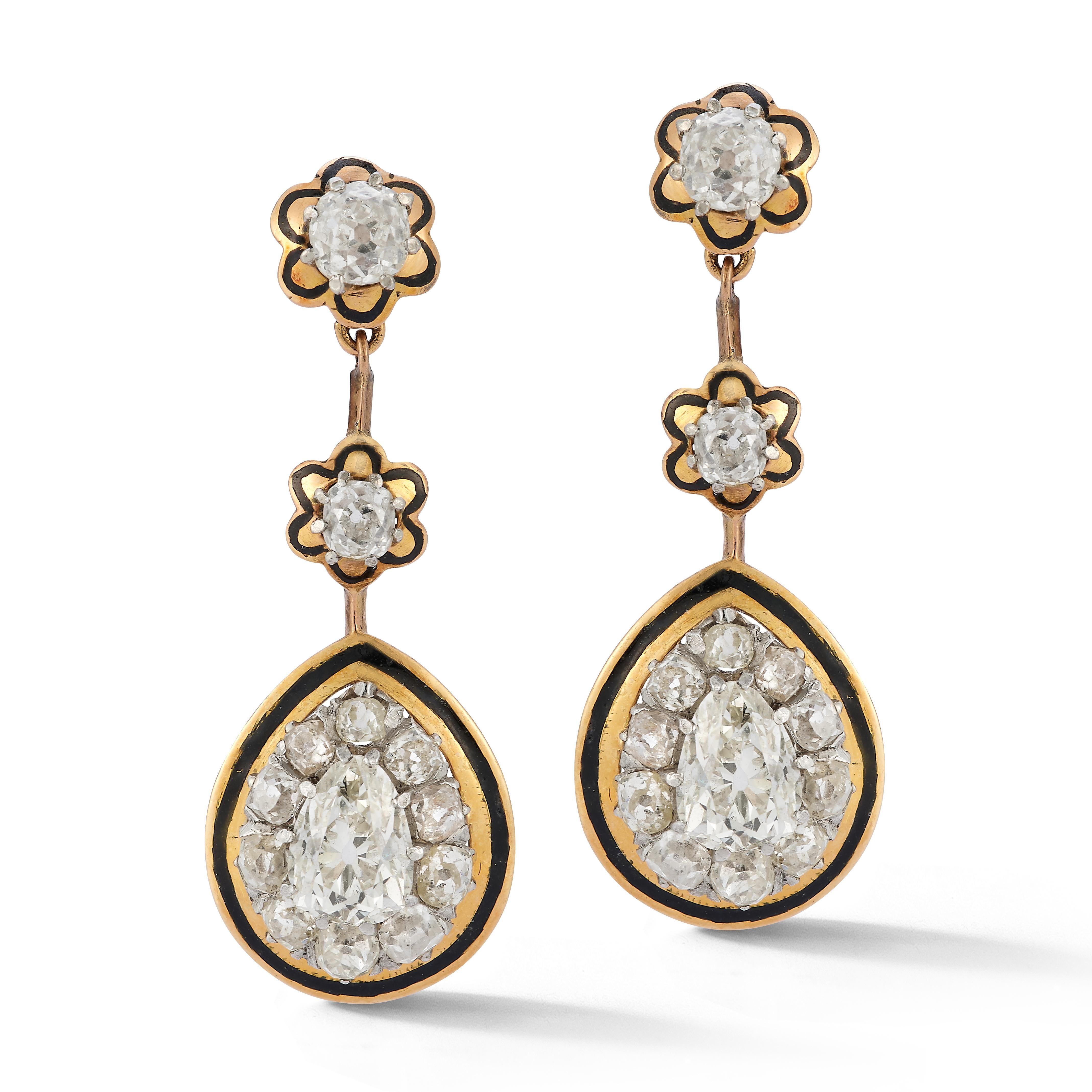Victorian Antique Cut Diamond & Enamel Earrings

A pair of 18 karat yellow gold and enamel earrings set with 2 pear shaped diamonds weighing approximately 1.95 carats and 24 old mine diamonds weighing approximately 2.93 carats

Circa 1900

Length: