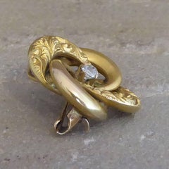 Victorian Antique Diamond Brooch, Gold Engraved Knot, circa 1890s, 15 Carat Gold