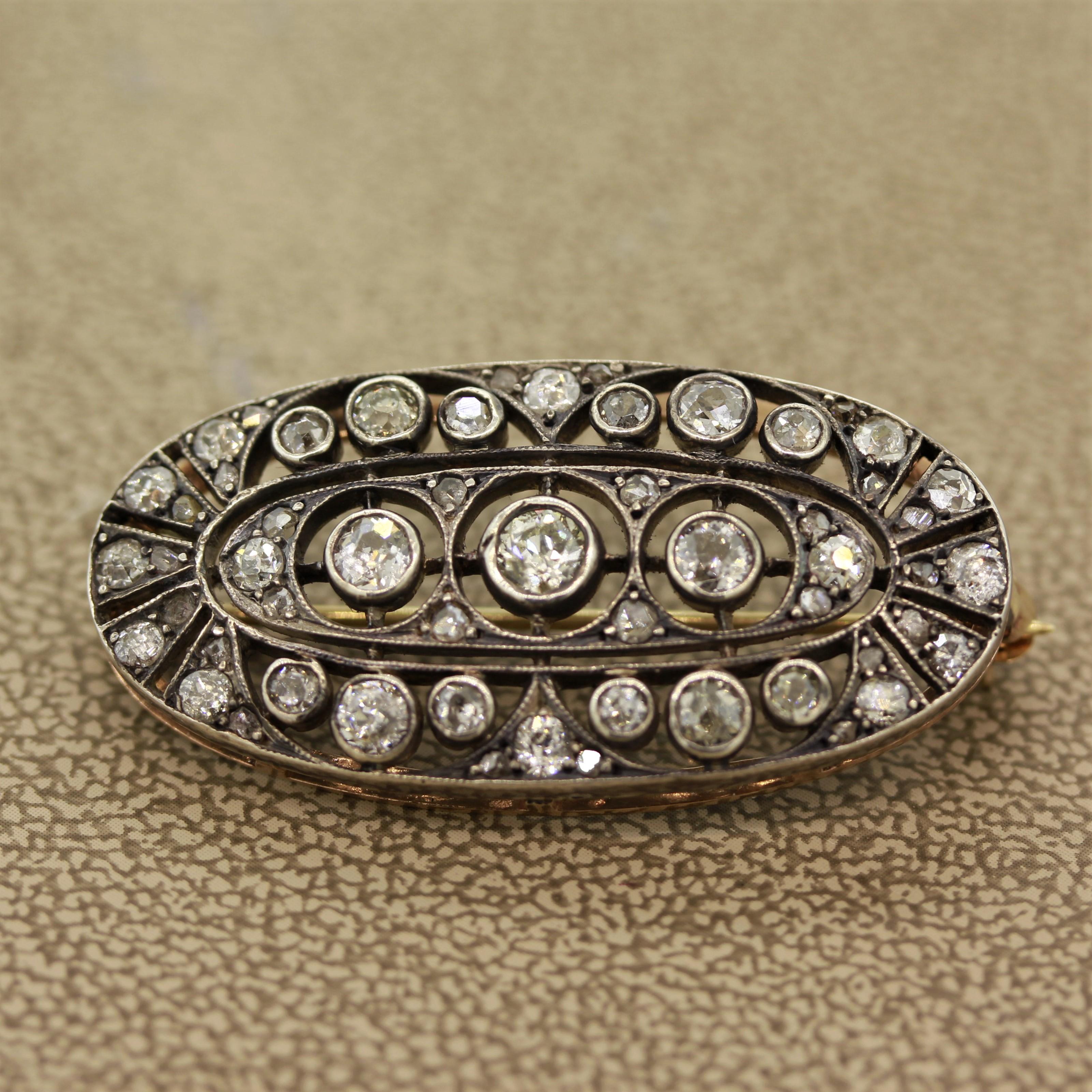 An antique from the Victorian era in original condition, circa 1895. It features approximately 2 carats of round European cut diamonds along with smaller rose cut diamonds. They are set in 14k gold and the top of the piece is “silver-topped” to give