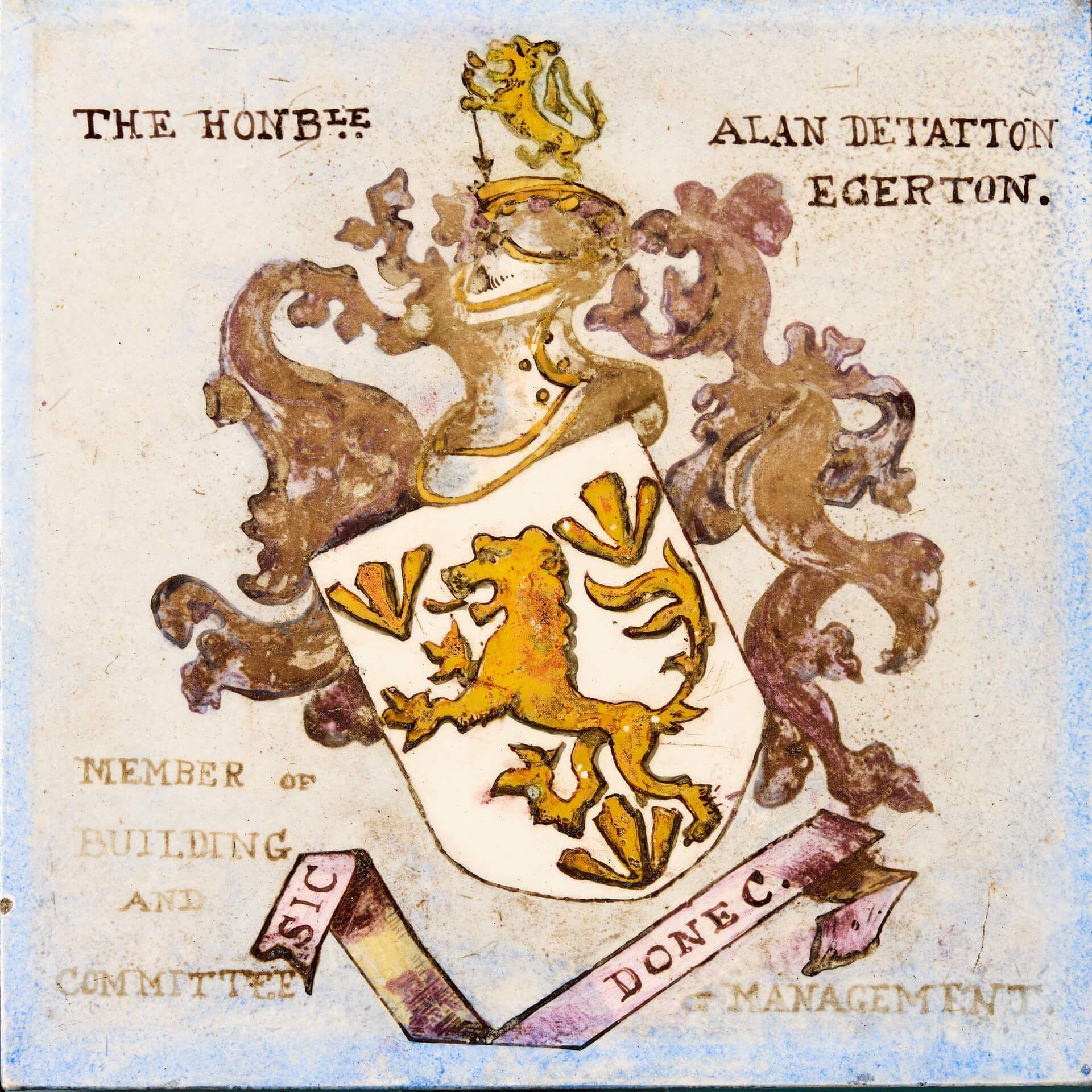 A hand decorated Victorian English armorial tile by J. D. Rochfort dating from 1881. This porcelain tile is one of 14 similar we are selling, removed from the now demolished library of the Victorian Brompton Consumption Hospital, London. It depicts