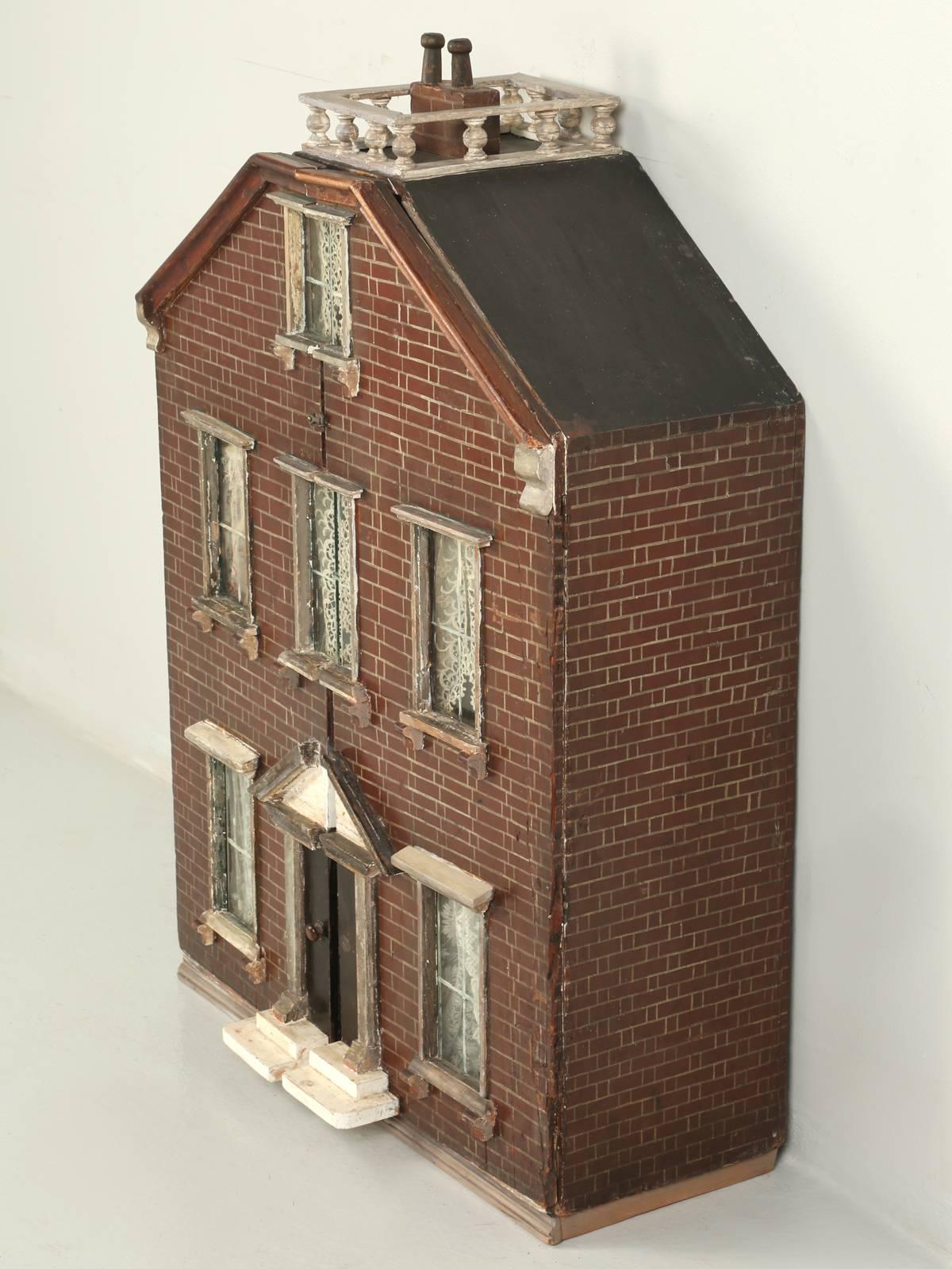 Victorian antique English dollhouse found in the town of Leek, England. One of our favorite English antique dealers came up with this very original English dollhouse, still with its original curtains. This antique dollhouse, just came out of a