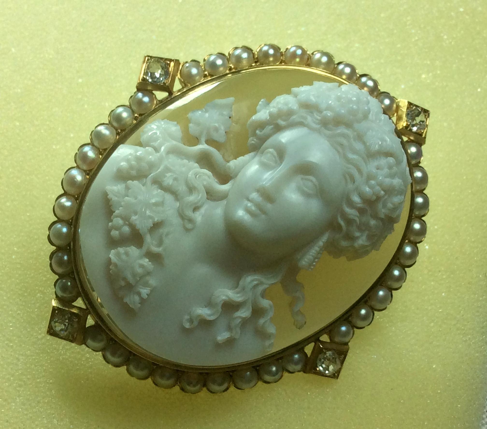 More than museum quality hard stone cameo mounted with 18k gold and diamonds depicting a rarest subject, the God Dionysus (Bacchus for the Romans) portrayed in front face. Dionysus was a popular subject on cameos in the Victorian era but rarest to