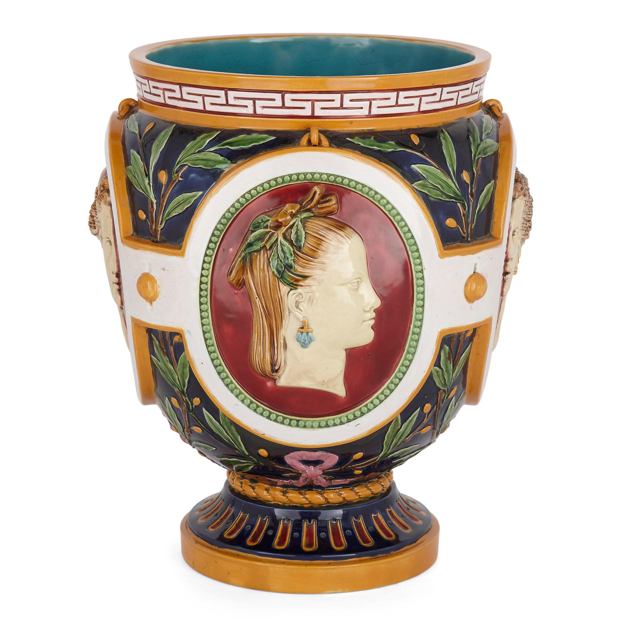 Victorian antique Majolica jardinière of the Four Seasons by Minton
English, c. 1905
Measures: Height 39cm, diameter 32cm

This characteristically colourful Majolica jardinière by Minton depicts four female relief profiles stylized as the Four