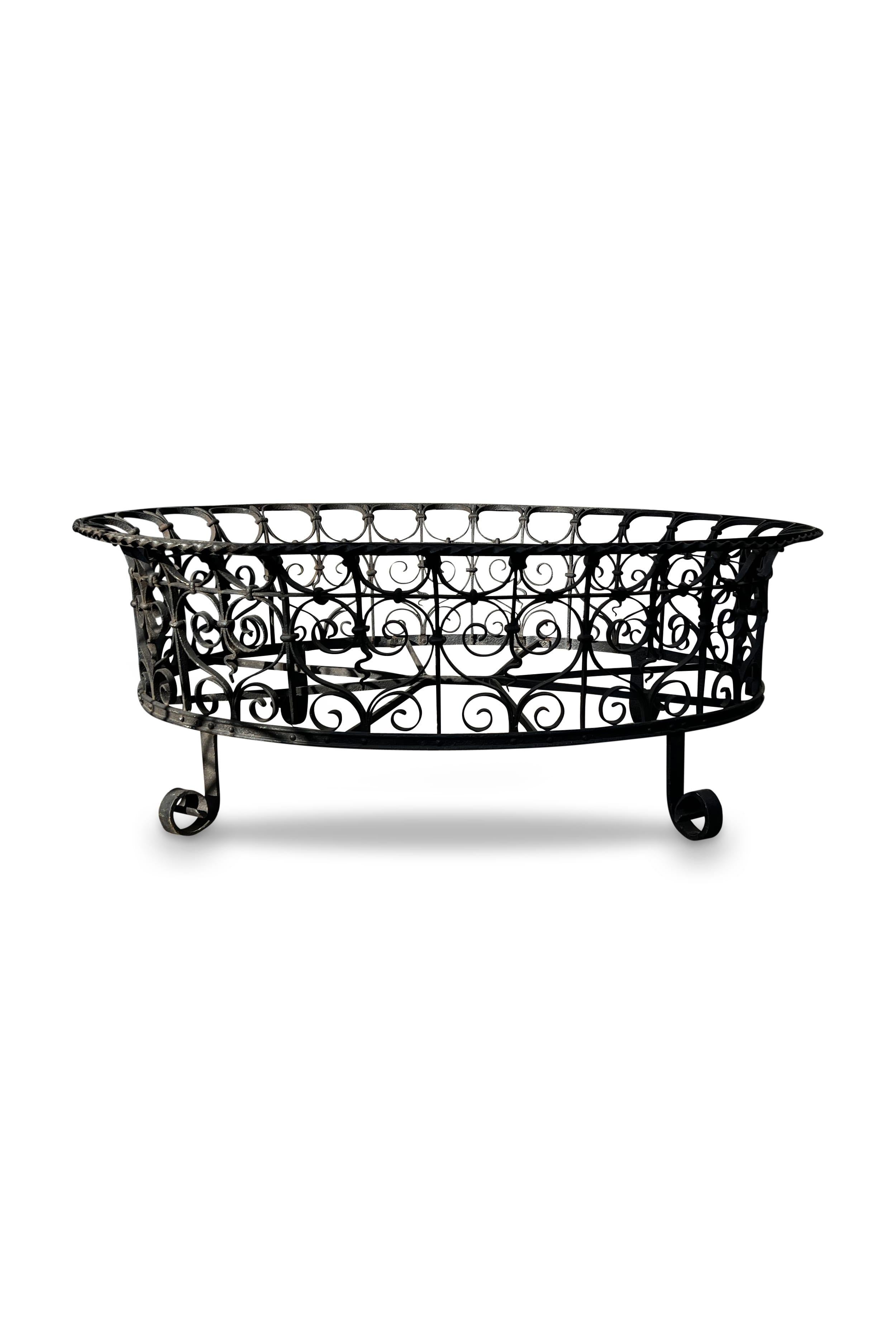 Immerse in timeless elegance with decorative scrollwork, dark hues, and a natural patina. A garden statement inspired by classic design.

Measurements: 44” L x 35.5” W x 16” H 

Condition: Consistent with antique age and usage.