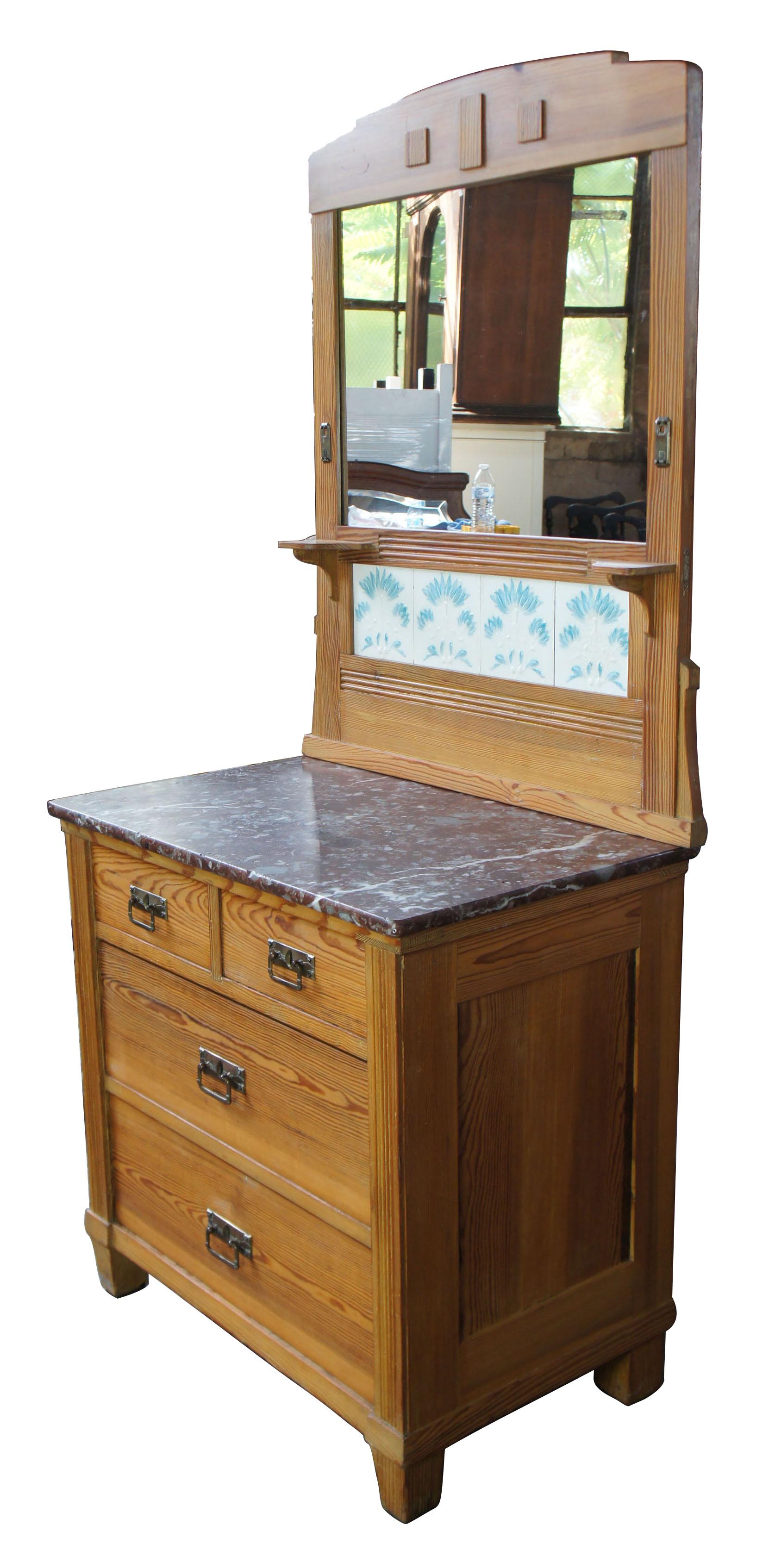 Victorian antique pine marble-top wash stand buffet M.O. P.F. German Tile mirror

Turn of the century solid pine marble-top washstand with tiled and mirrored back. Features 4 hand dovetailed drawers and brass hardware.

German Art Nouveau Tiles,