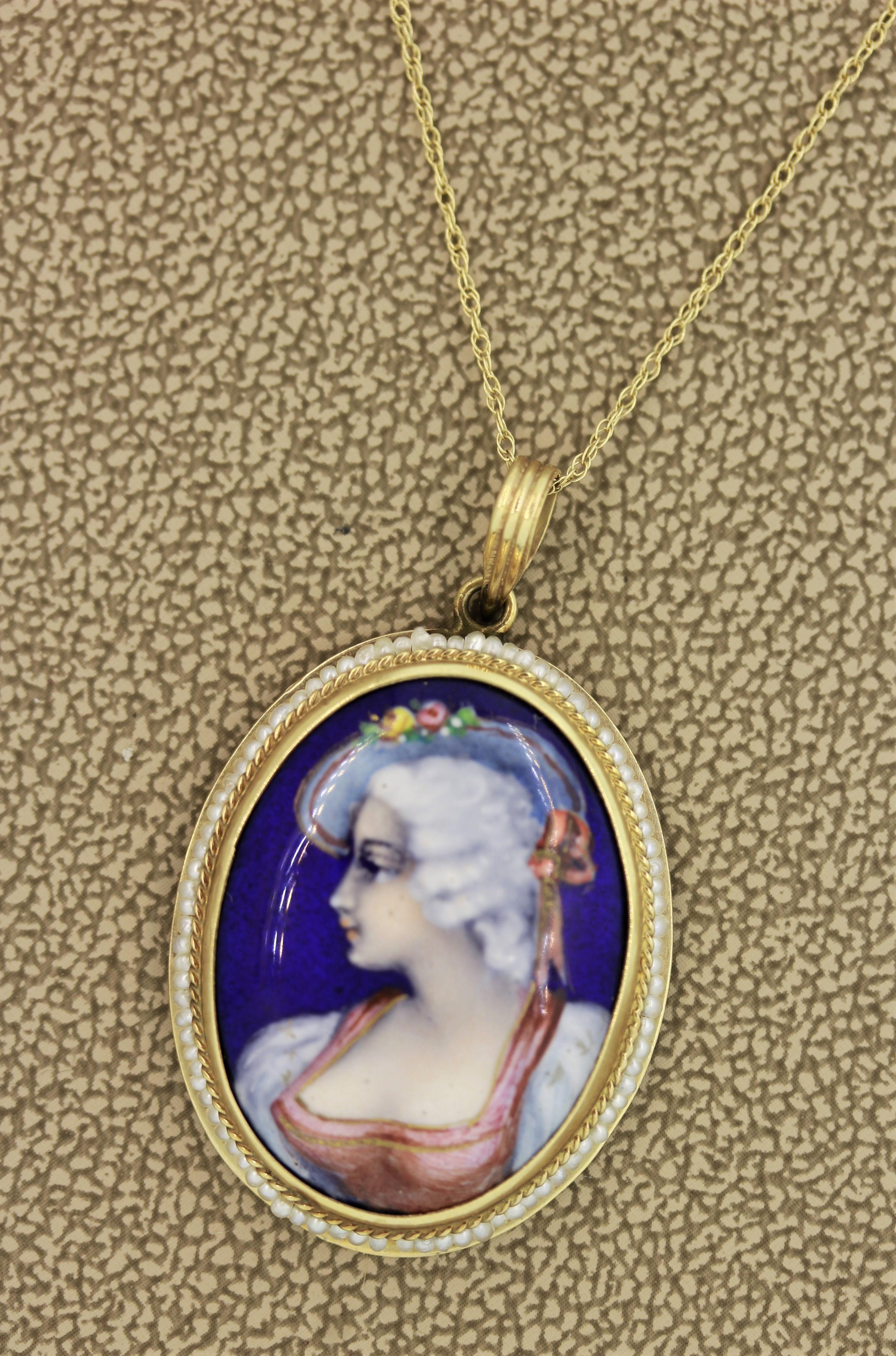 A lovely example of Victorian design. These pendant features a hand painting of a dignified woman with a flower hat. It is full of detail and life. It is accented by a hand made braided gold frame and natural seed pearls which halo the piece. Made