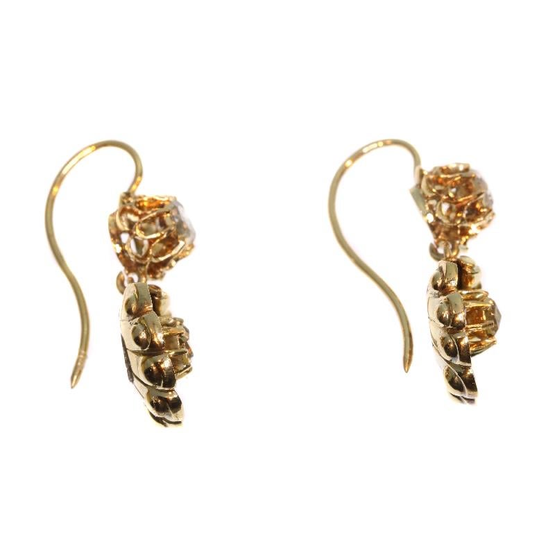 A pair of Victorian drop earrings in 14 karat yellow gold set with 18 rose cut diamonds. Height 1.10 inch. Weight 5.80 gram.