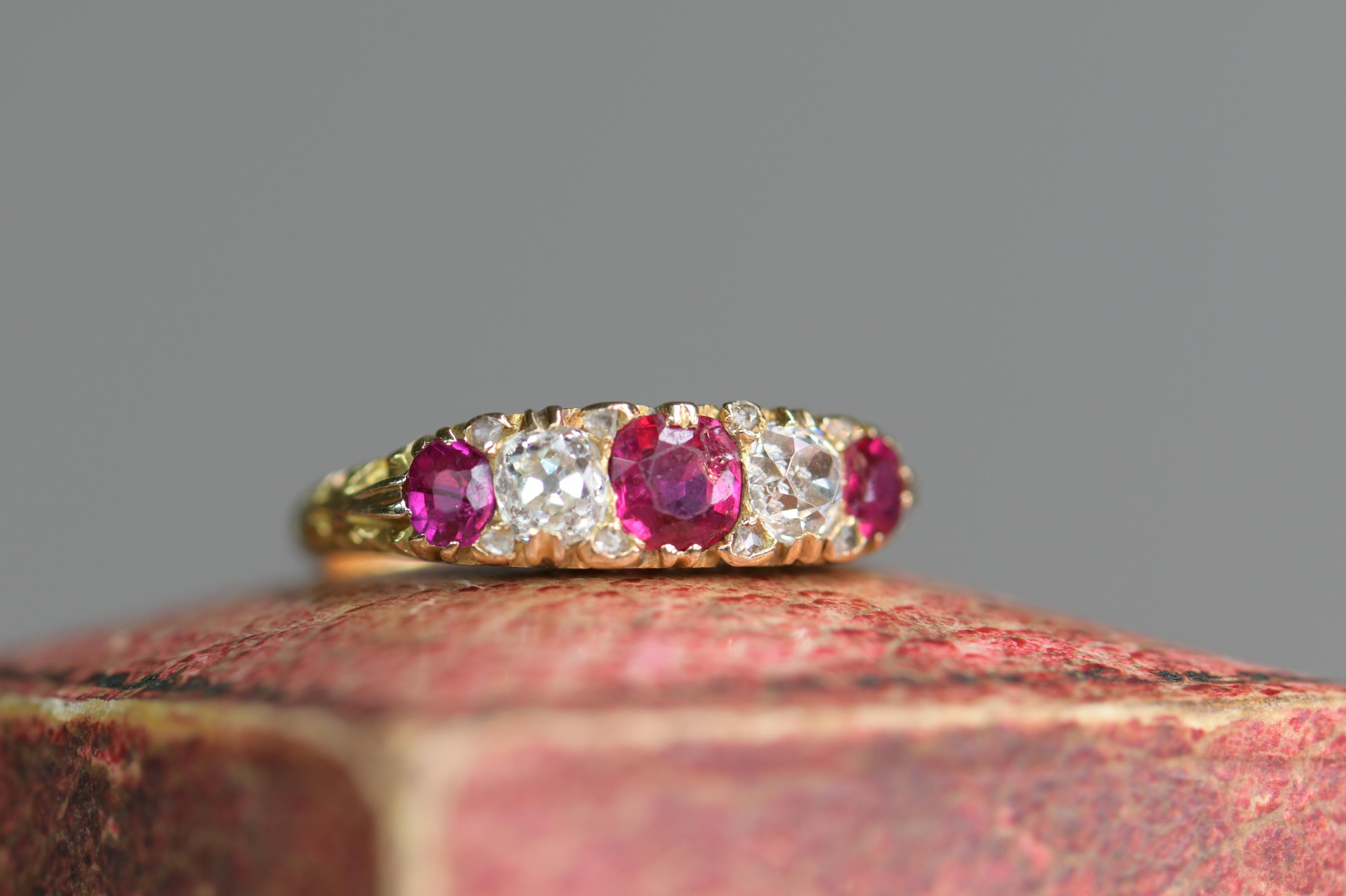 This is a Victorian 18ct yellow gold ring featuring three alternating rubies and two old cut diamonds with old-cut diamonds set in between each stone in a carved yellow gold shank.

The contrast of alternating colors works really well, one gem