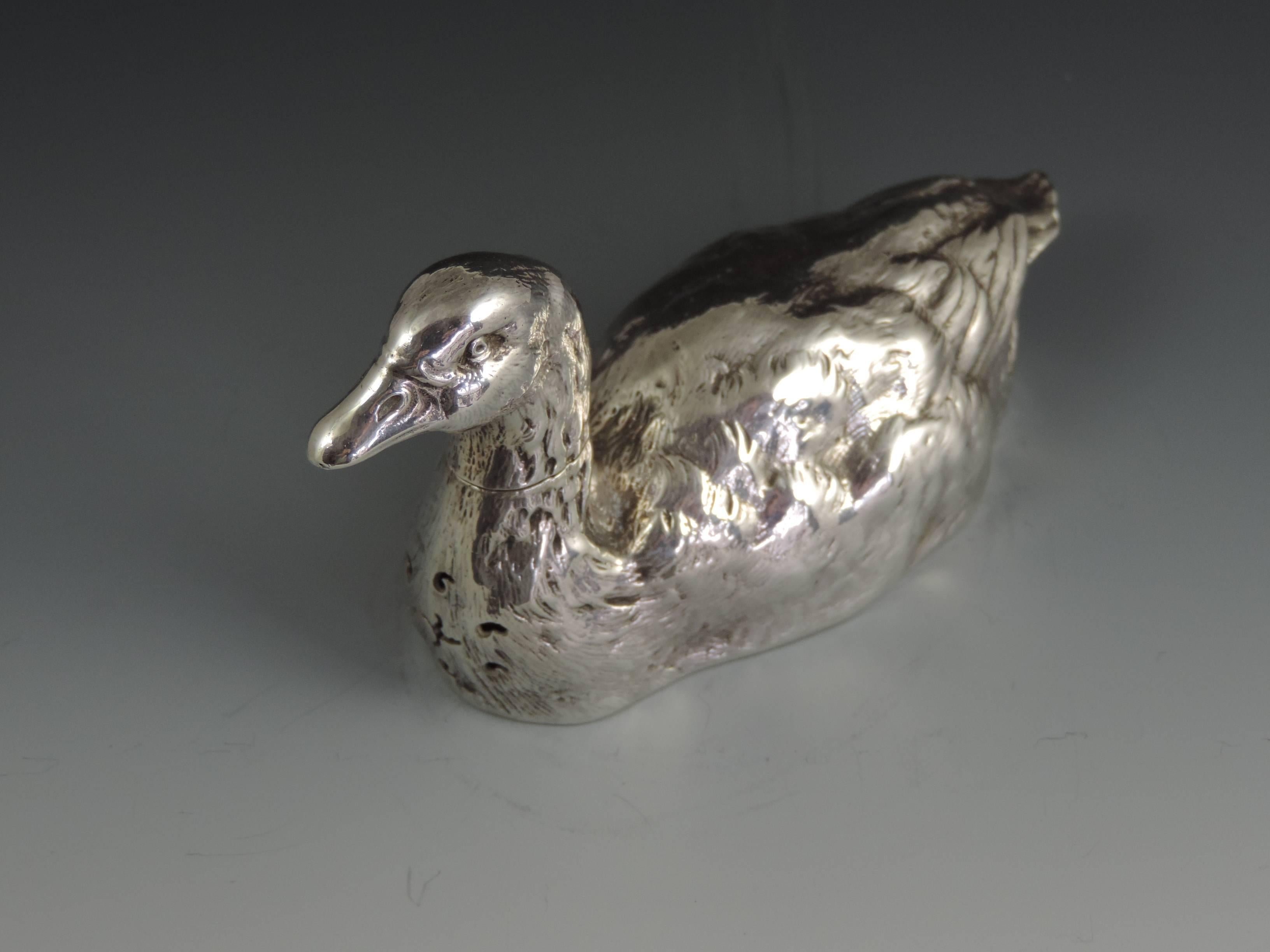 A very fine quality and rare cast novelty silver pepper made in the form of a swimming farmyard Goose, with pull-off head and pierced breast.

By James Barclay Hennell, London, 1883

In good condition with no damage or repair.

Measure: Height