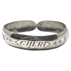 Manchette victorienne ancienne «heri » gravée de fleurs en argent