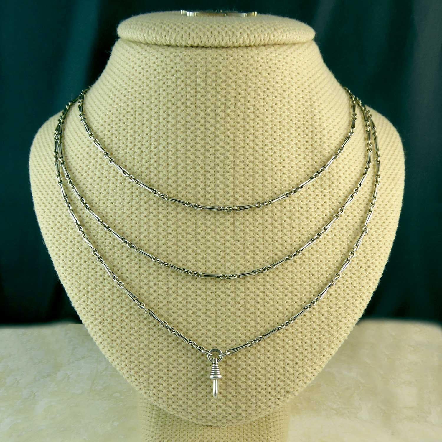 Creating in the later 1800s, this Victorian silver long chain is in excellent condition.  Also known as a guard chain, these antique chains are immensely versatile being able to be worn in various ways due to the 60 inch length.  This is a very fine