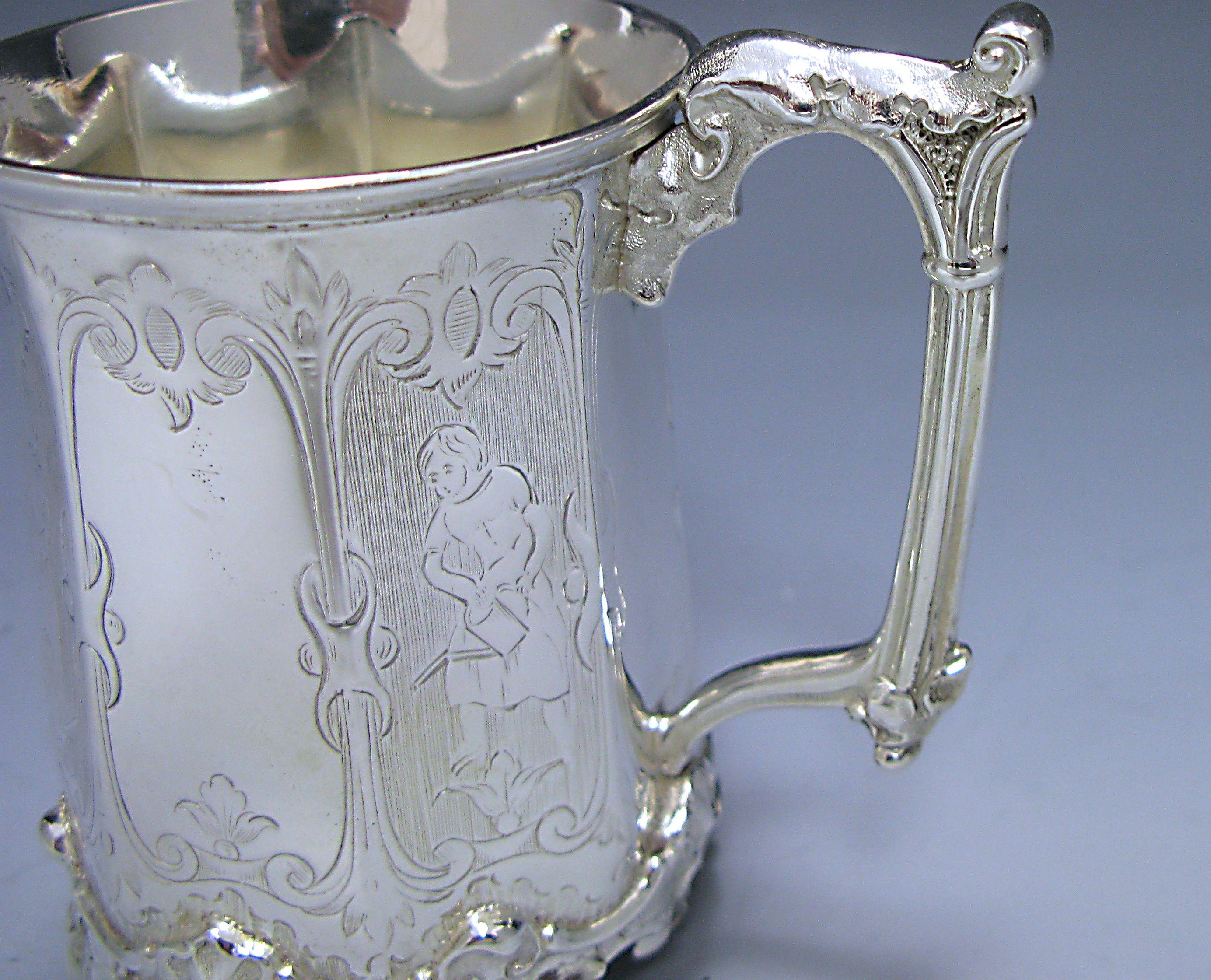 A Victorian antique silver octagonal sided Christening mug. The panel opposite the handled is engraved with flowers, four panels are engraved with figures depicting rural activities. The three remaining panels are plain apart from a floral design at