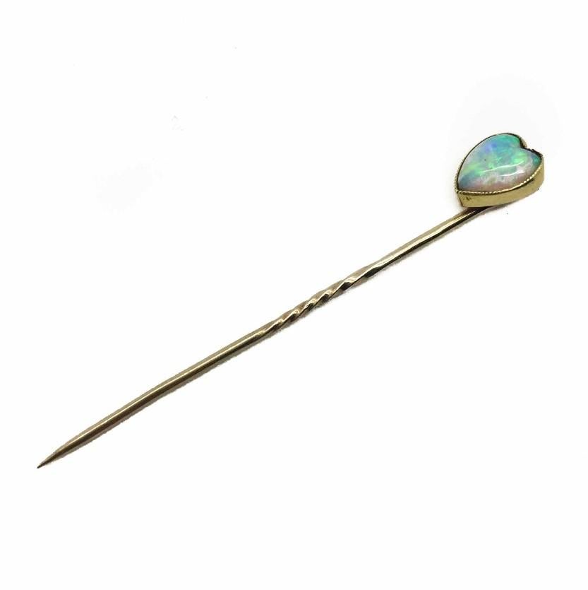 A Victorian Natural Opal Heart Stick Pin. This charming opal stick pin centres on a delightful heart shaped natural opal set in solid 9ct gold. This piece dates from around 1890-1900 and is a lovely piece of Antique jewellery. This Victorian Opal
