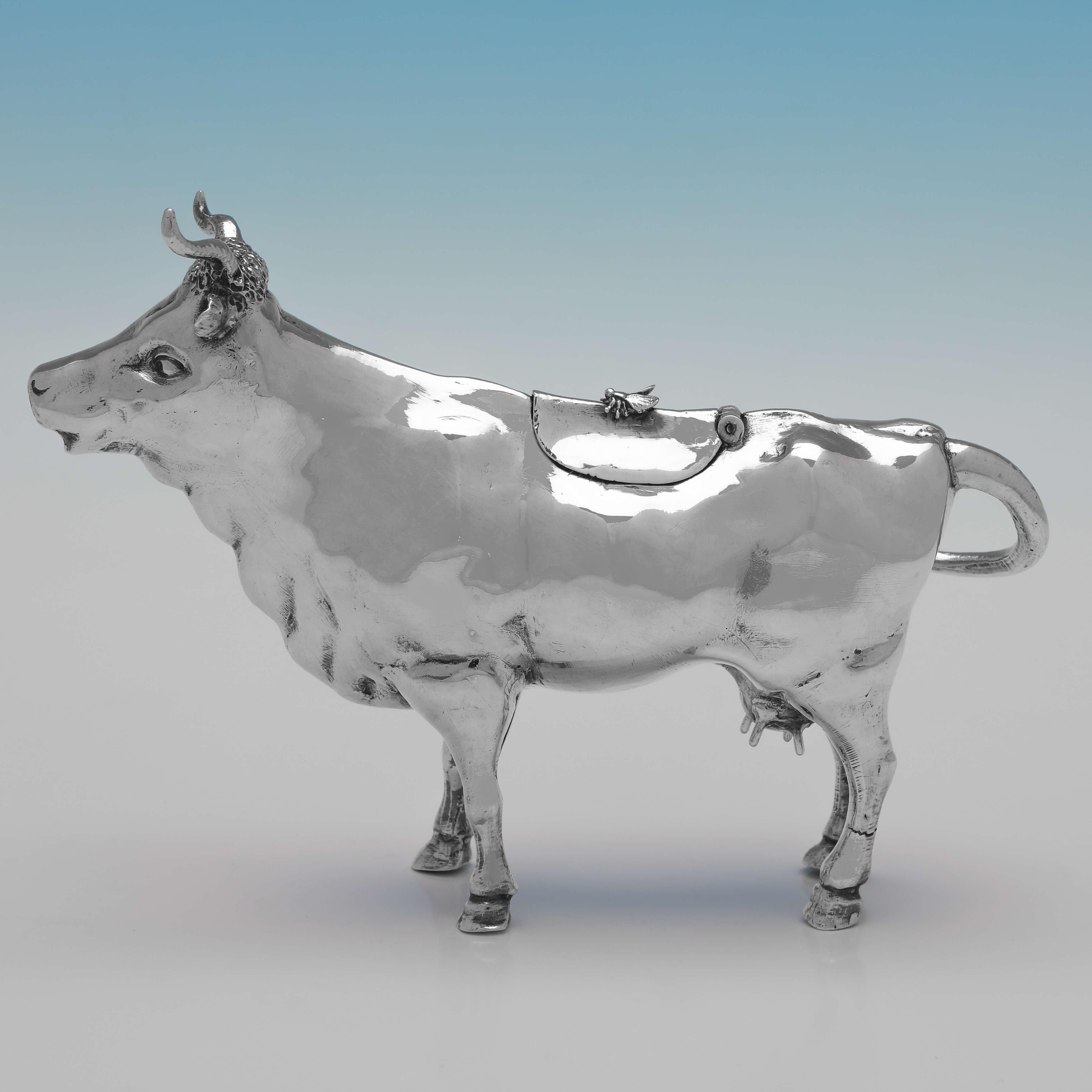 Carrying import marks for London in 1896 by Edwin Thompson Bryant, this charming, Antique Sterling Silver Cow Creamer, is handsomely modelled. 

The cow creamer measures 4.75