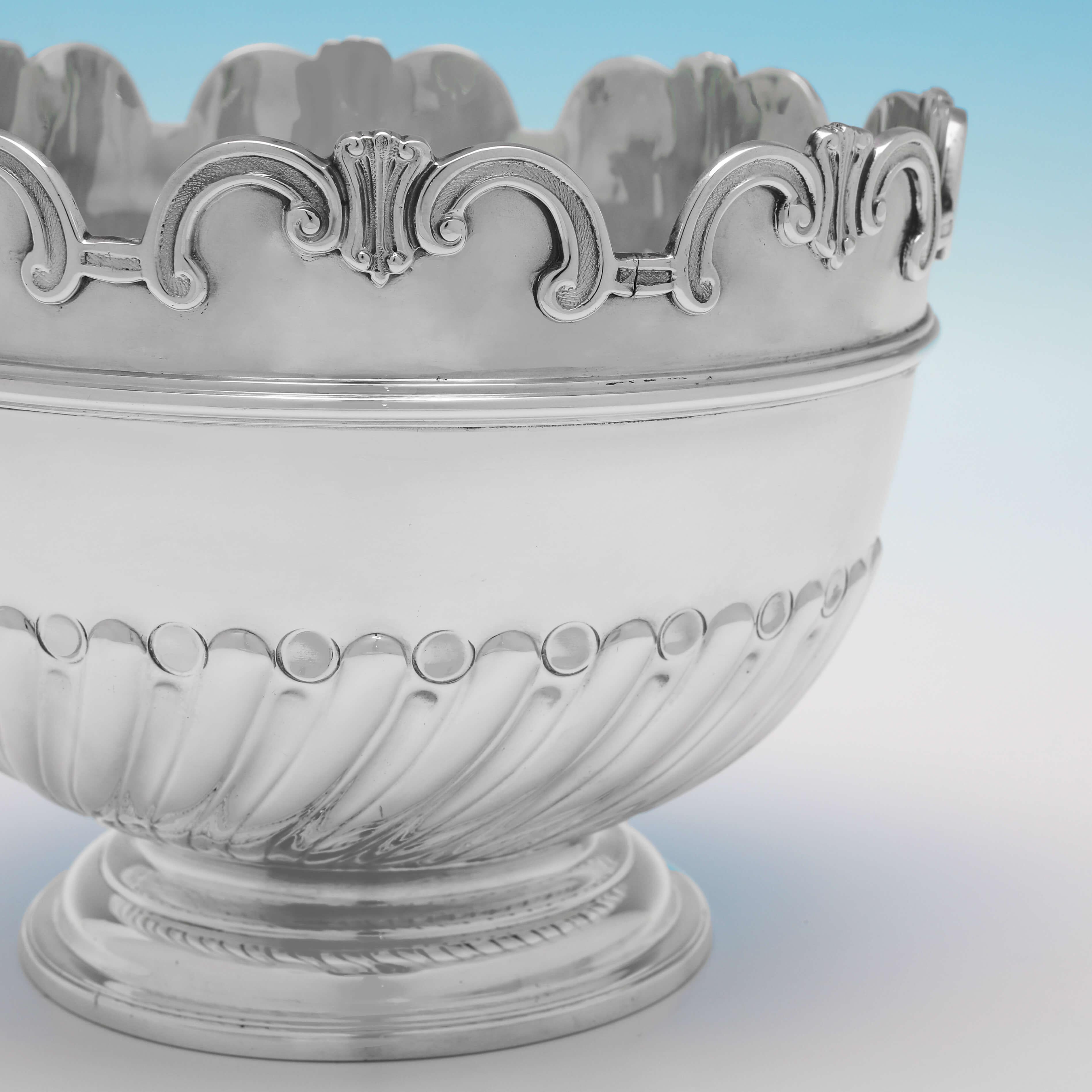 Hallmarked in London in 1896 by Charles Stuart Harris, this attractive, Antique Sterling Silver Bowl, features a shaped rim, and sunken and swirled fluting to the body. 

The bowl measures 4.5