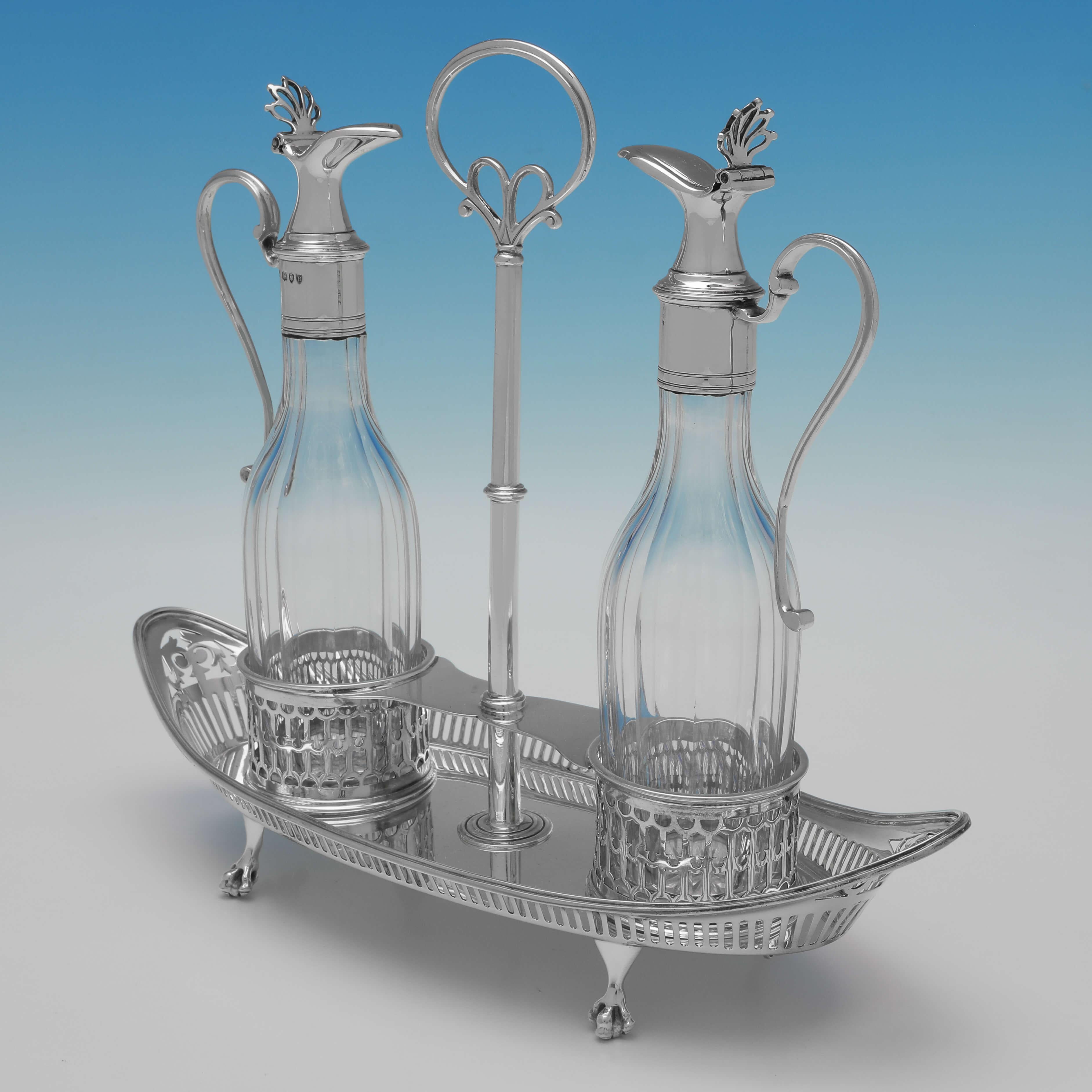 Hallmarked in London in 1892 by Thomas Bradbury & Sons, this attractive, Victorian, Antique Sterling Silver Oil & Vinegar Set, is in the Neoclassical revival style. 

The oil & vinegar measures 9.5