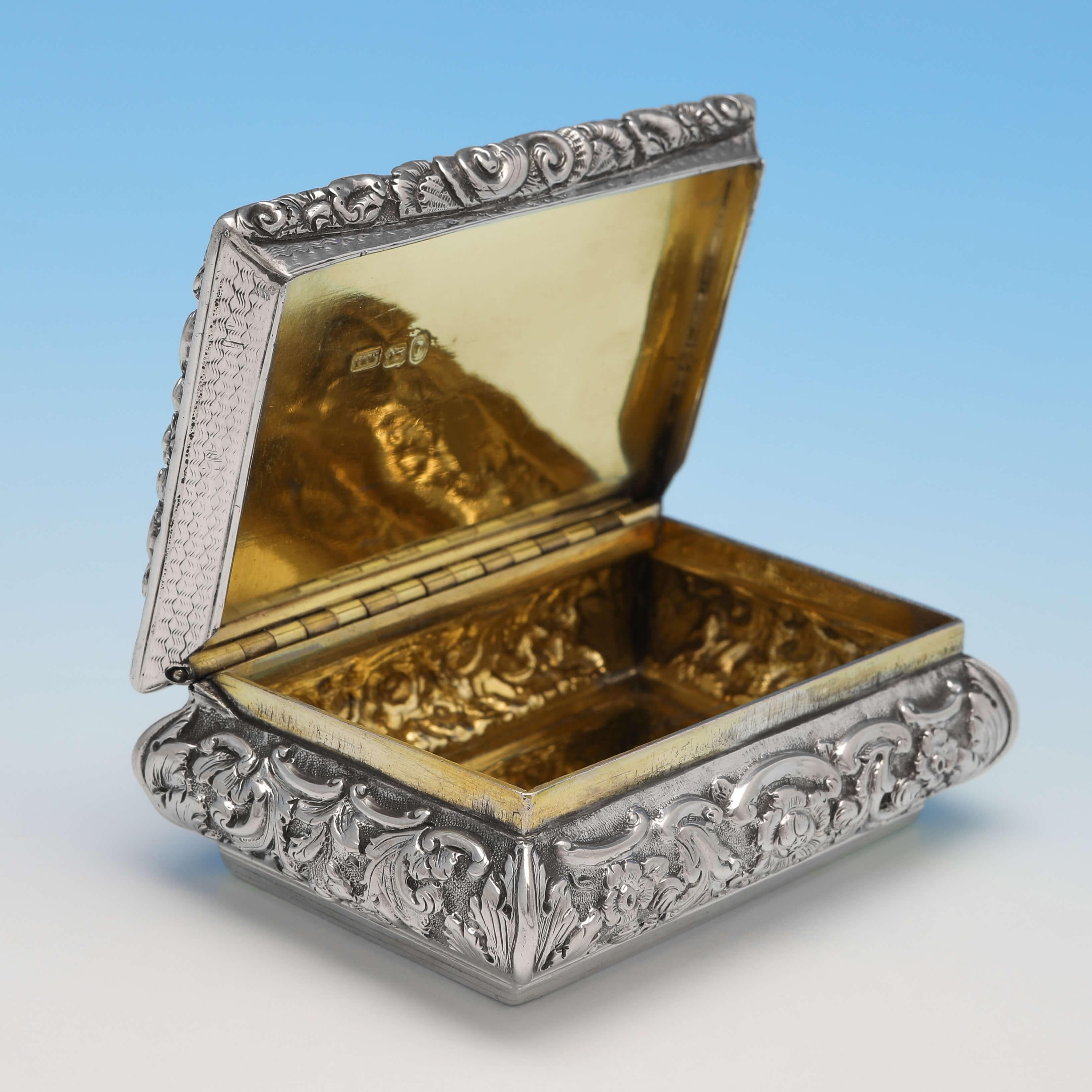 Hallmarked in Birmingham in 1845 by Yapp & Woodward, this attractive, Victorian, antique sterling silver snuff box, features cast floral borders and a gilt interior. The snuff box measures: 3.25