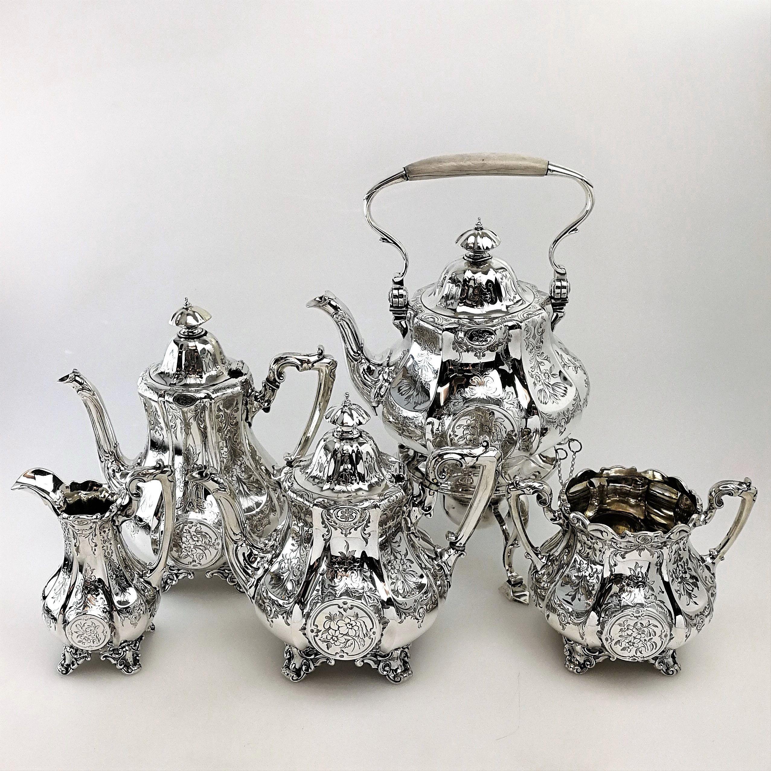 An antique Victorian 5-piece solid Silver Tea Set comprising of a Kettle on Stand with burner, Teapot, Coffee Pot, Sugar Bowl & Cream / Milk Jug. The Tea Set has an elegant panelled octagonal shape and is embellished with gorgeous floral engraving.