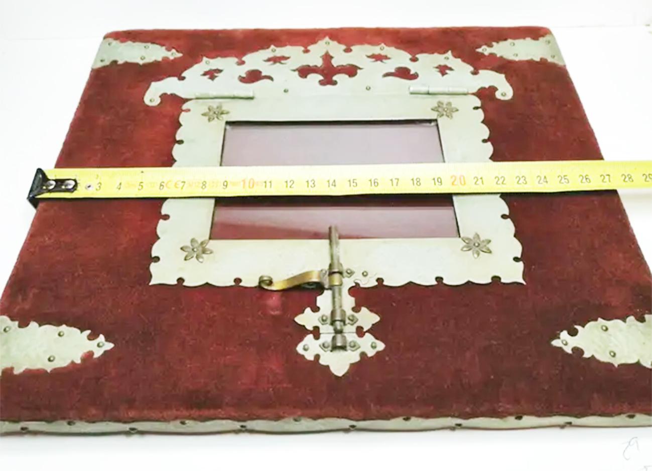 Antique frame  reliquary of embossed alpaca and velvet used to frame image or religious relic
comes from Andalucia, Spain

It is to hang on the wall and has a door with an iron where to place the object you want to introduce

It is a unique,