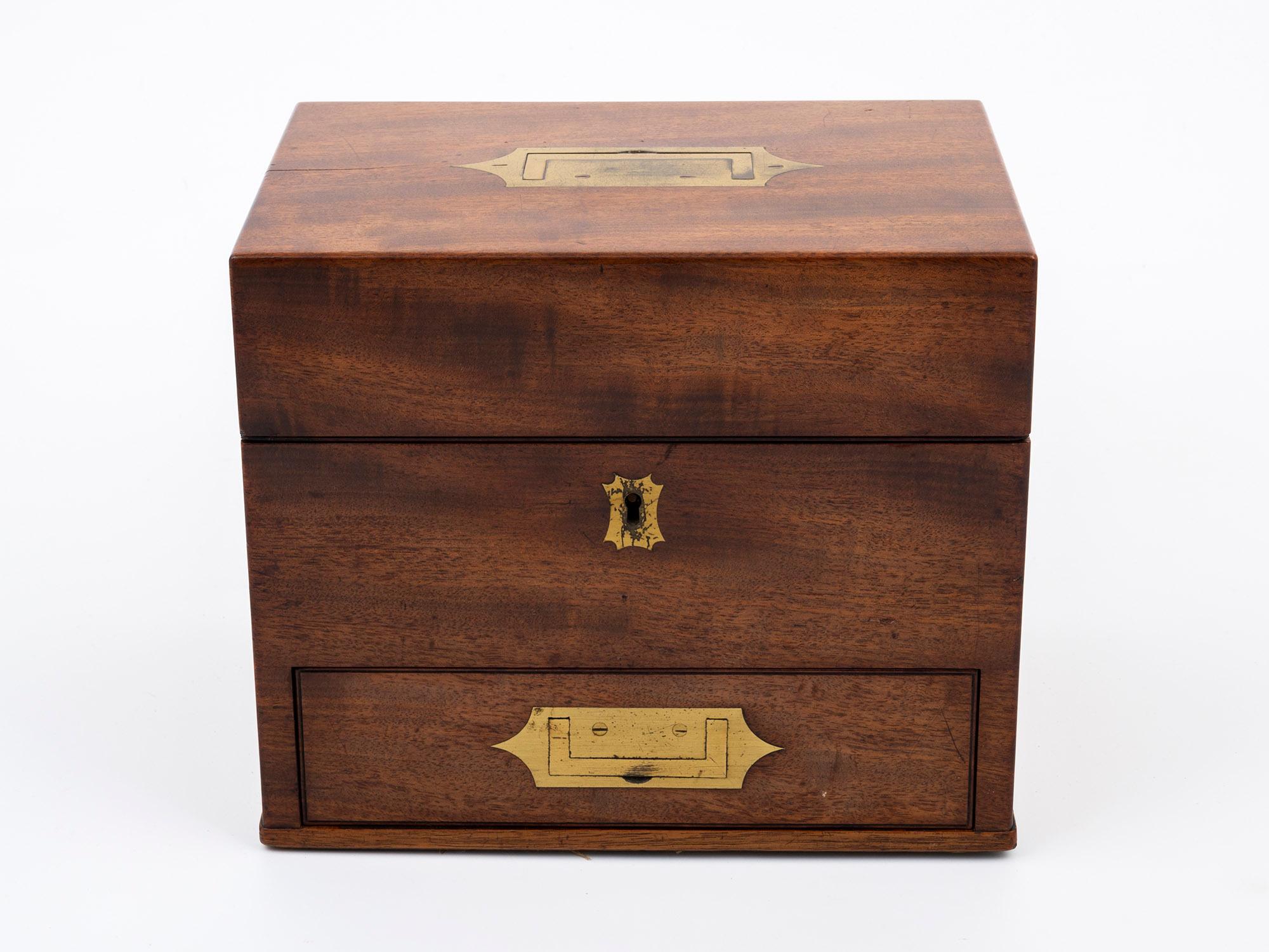 Complete 14 Glass Jars

From our Apothecary collection, we are delighted to offer this Mahogany Apothecary Box. The Apothecary Box of square form made from solid Mahogany with two flush mounted handles one to the bottom drawer and one to the lid and