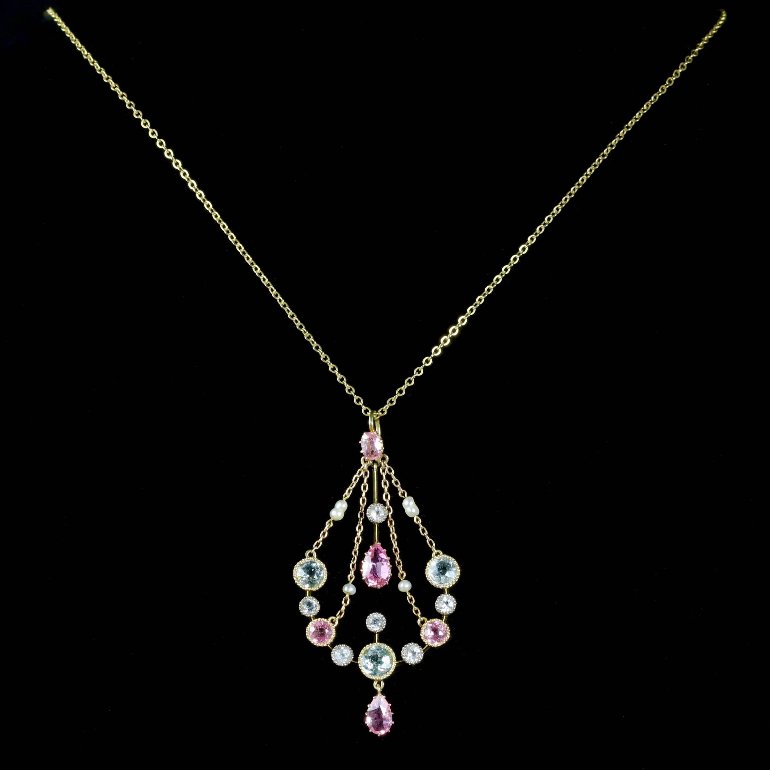 This fabulous Victorian 18ct Gold necklace and pendant is Circa 1900.

The wonderful pendant is decorated in beautiful blue Aquamarines, Pink Sapphires and lovely Baroque Pearls which compliment each other superbly on the pendulum style