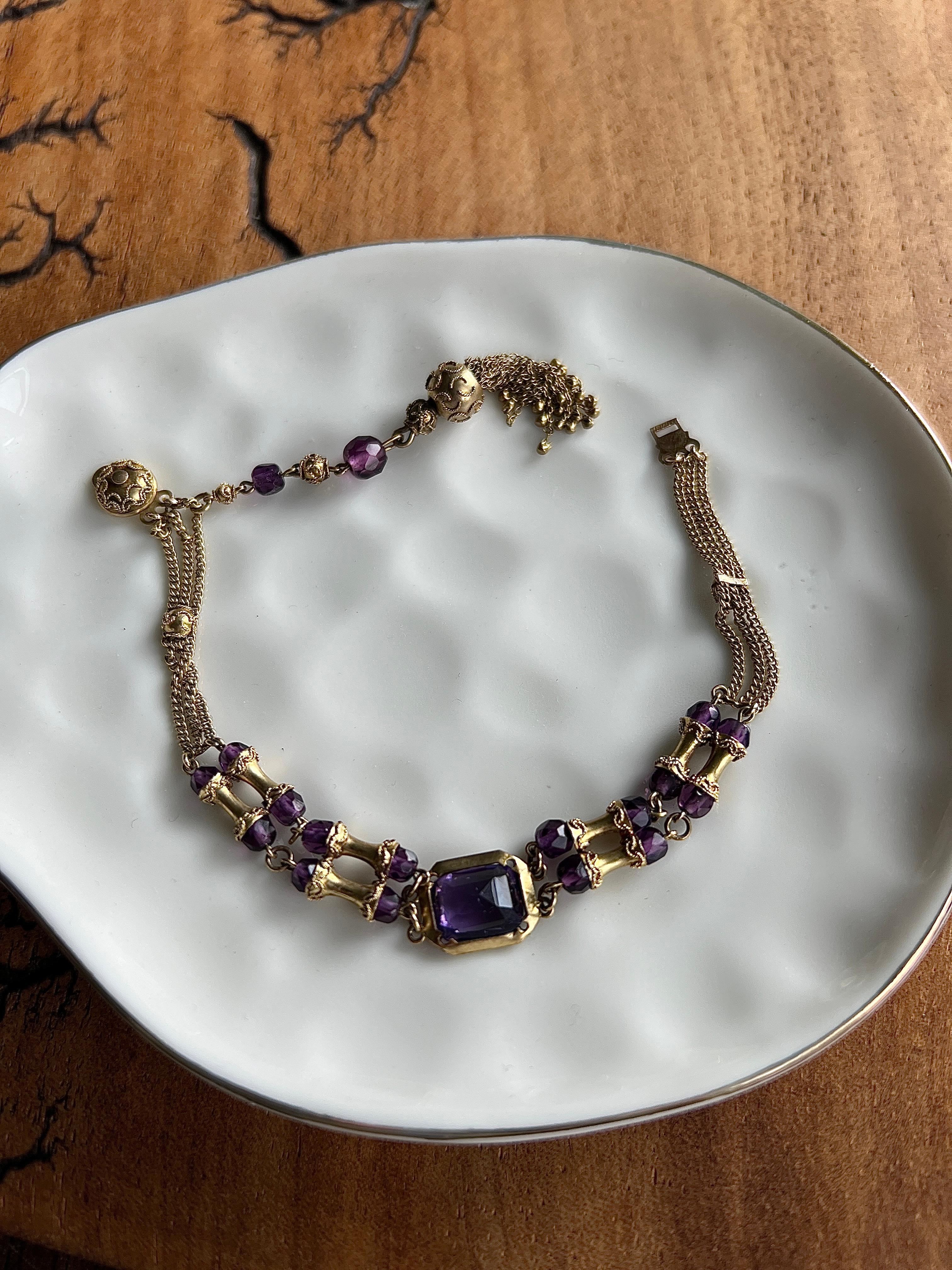 
A distinctive 10 karat yellow gold chain bracelet from the Victorian era, designed in the Archaeological Revival style that flourished during the mid-to-late 19th century. Measuring 7 inches in length, this piece is adorned with eighteen deep