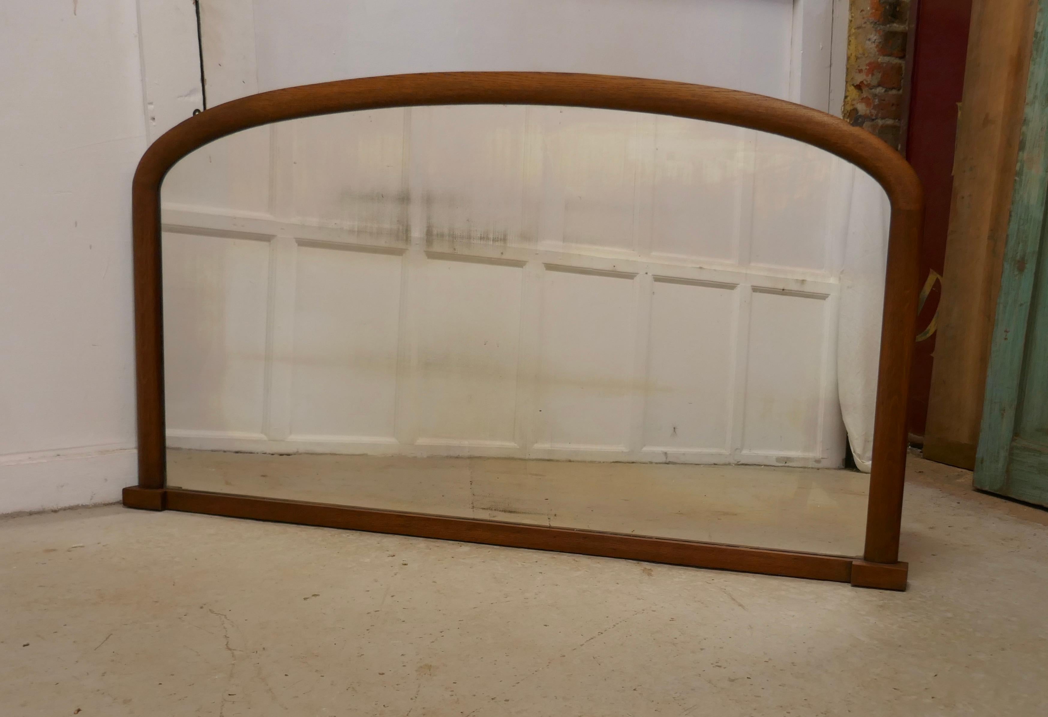 Victorian arched oak over mantle mirror

A lovely Victorian oak over mantle mirror

This is a charming piece, the arched frame is slightly curved with small feet at the base
The mirror is in good condition, the mercury looking glass is entirely
