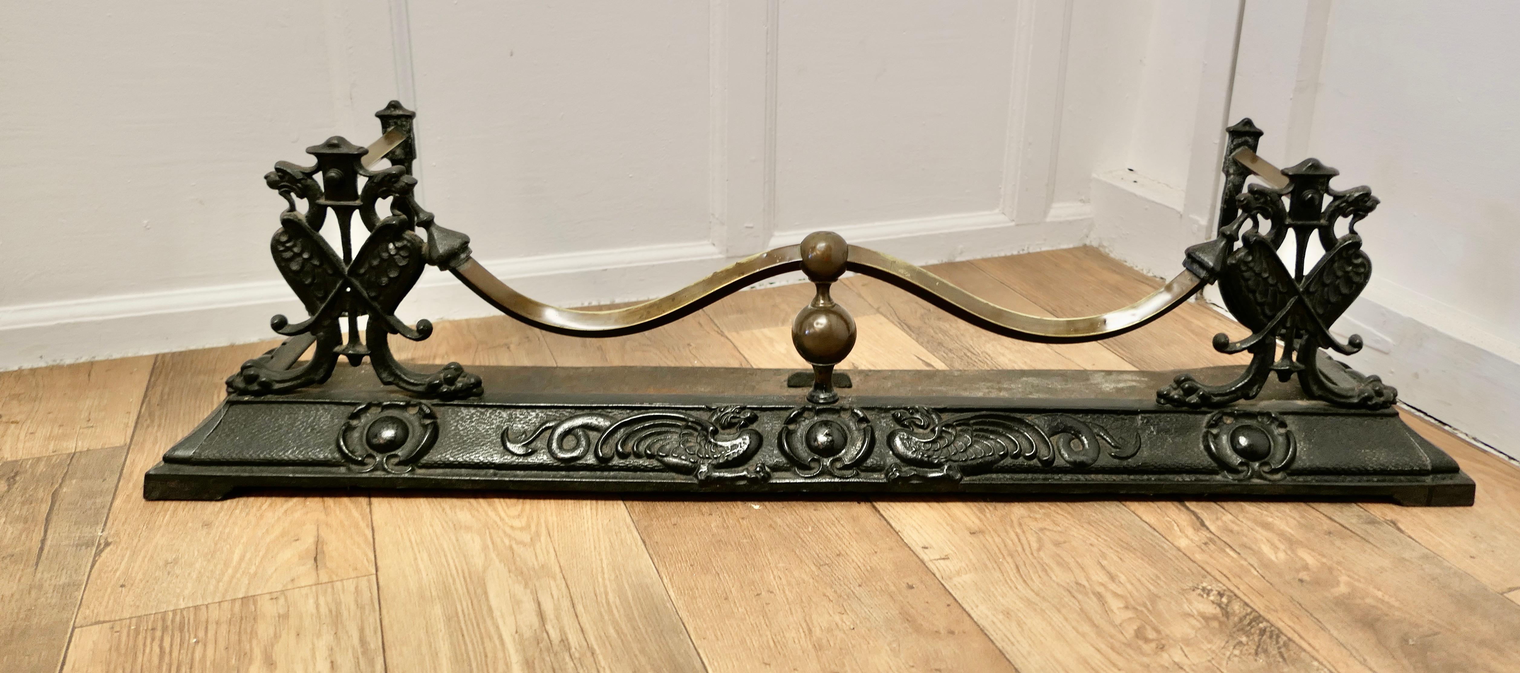 Victorian Art Nouveau Cast Iron and Brass Fender

This is a Beautifully Designed Victorian Fender it has superb Art Nouveau decoration showing Dragons and Serpents
The Fender is in good sound condition it is 12” high, and 45” long and 12”
