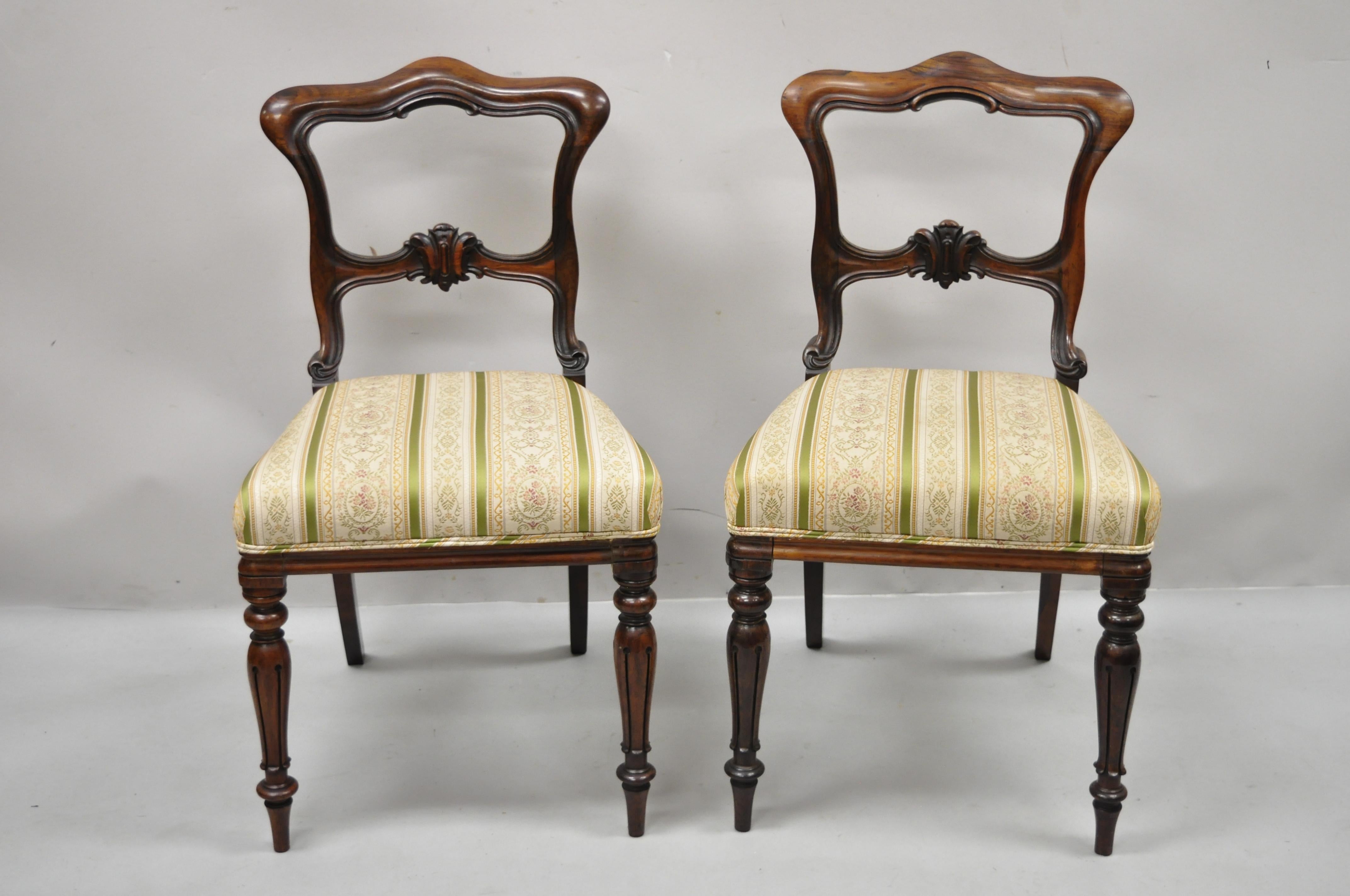 Antique Victorian Art Nouveau Transitional rosewood carved Parlor side chairs - a pair. Item features solid rosewood frame, beautiful wood grain, nicely upholstered seat, nicely carved details, tapered legs, shapley saber legs, very nice antique
