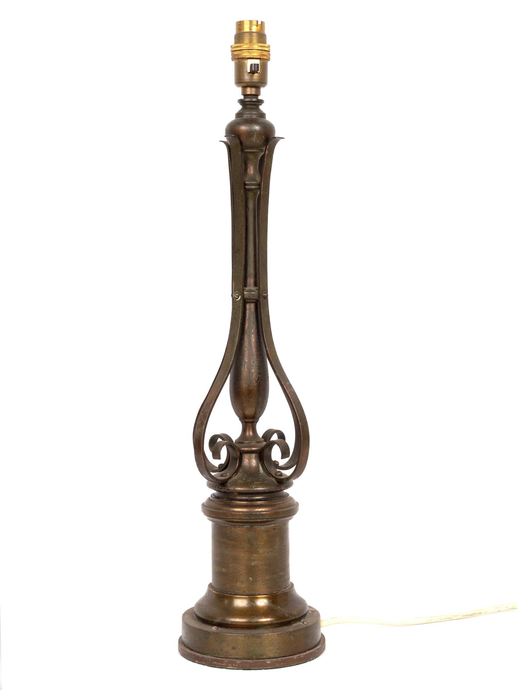 A converted English oil lamp from the Arts & Crafts Movement.
Dating from C.1895.
The brass lamp is accompanied by a vaseline glass shade.
   