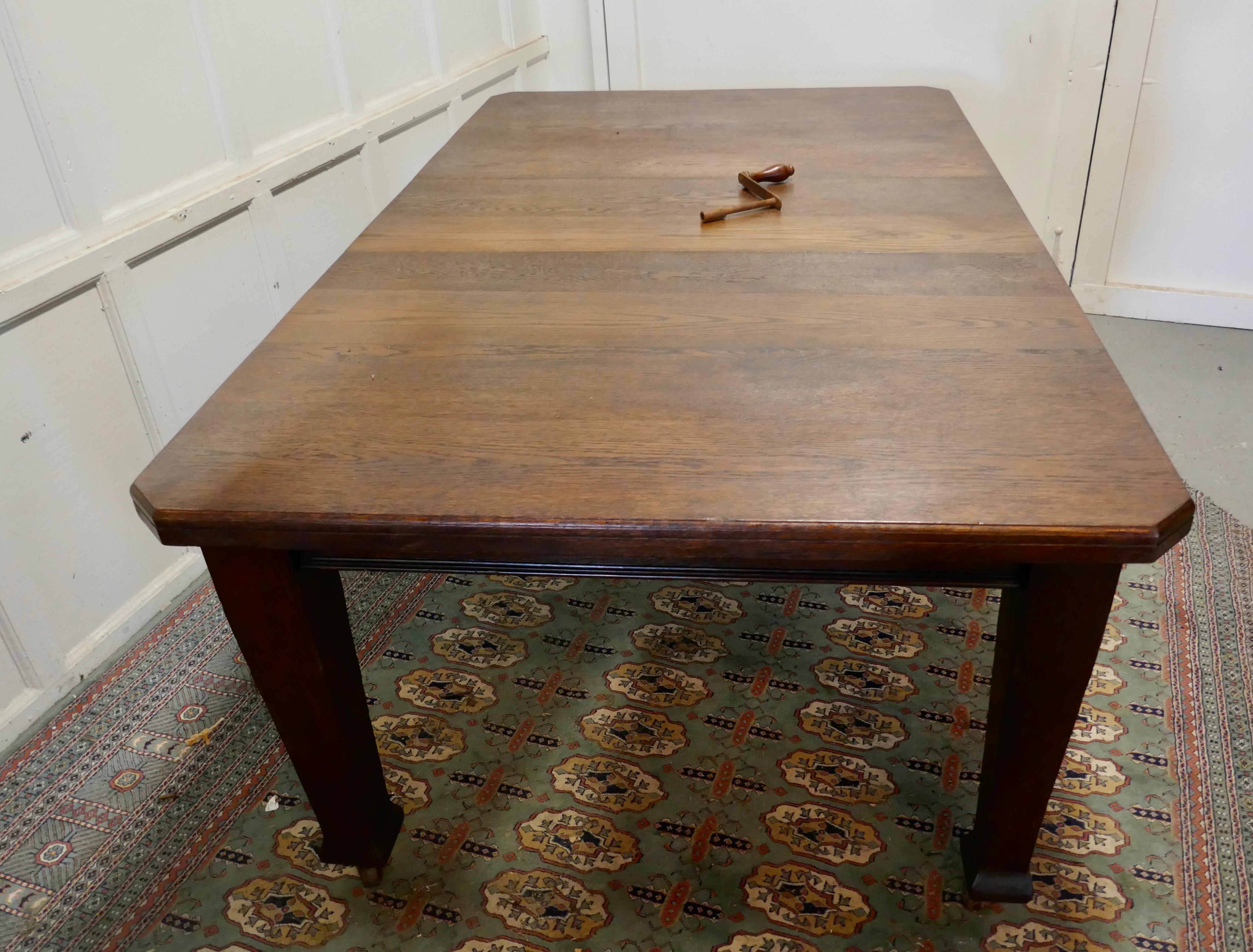 Victorian arts and crafts oak wind out table, extending dining table.