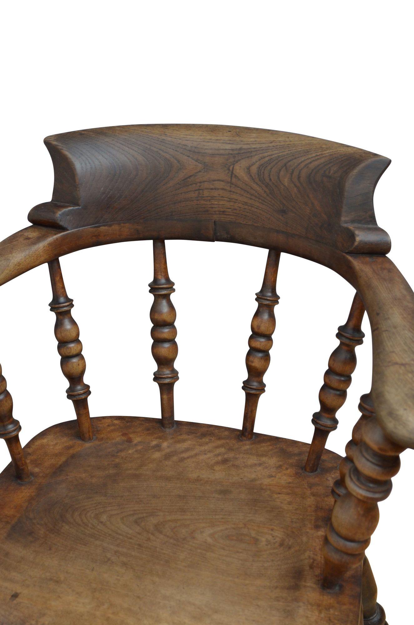 0239 Late Victorian ash and elm smokers bow armchair with shaped top rail supported on turned uprights and generous seat, all standing on substantial turned legs united by double stretchers. This chair is in original, ready to place at home