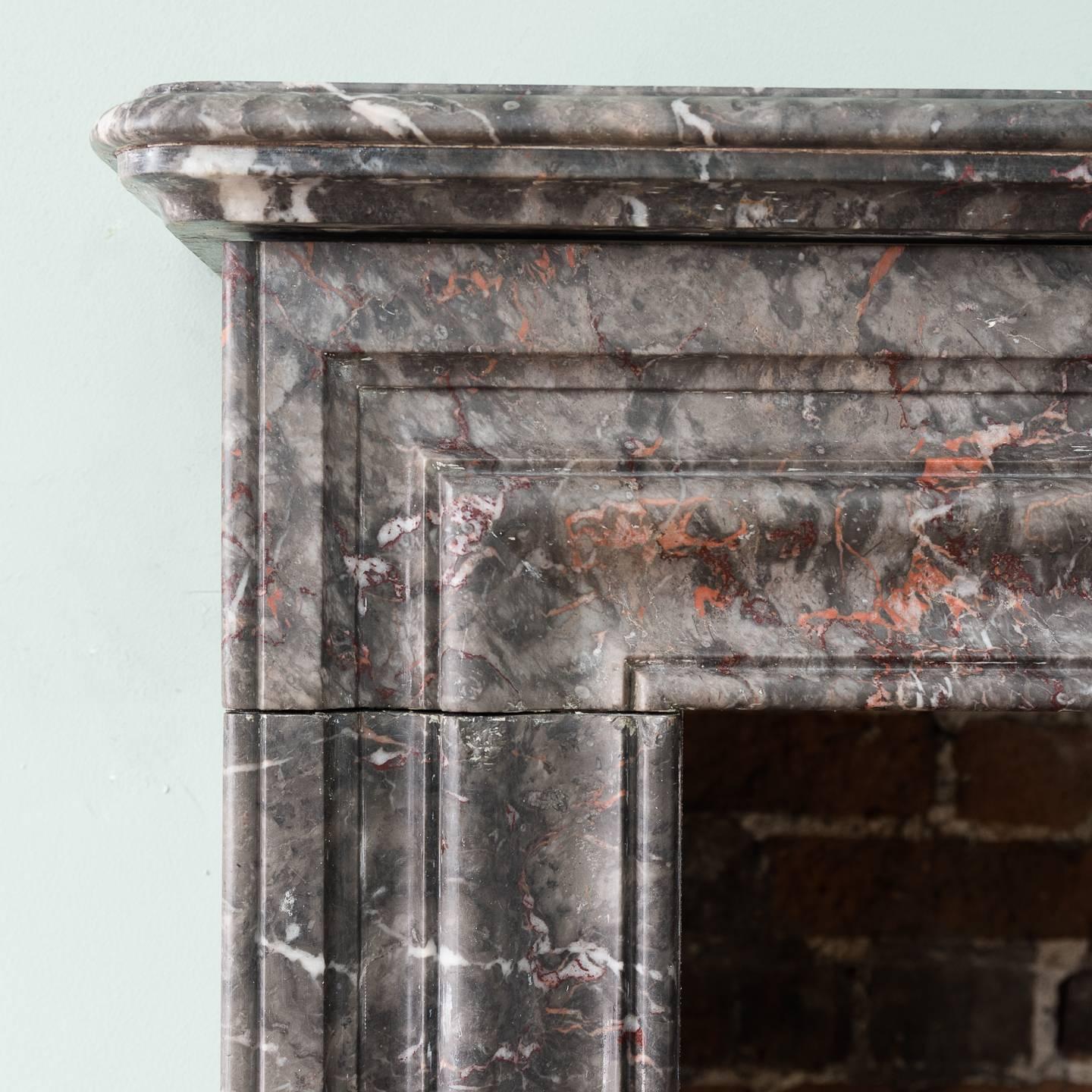 A Victorian Ashburton marble (limestone) chimneypiece, with conforming bolection moulded frieze and jambs, on shaped footblocks.

Two other chimneypieces to the same design are also available.

Measures: 112cm (44