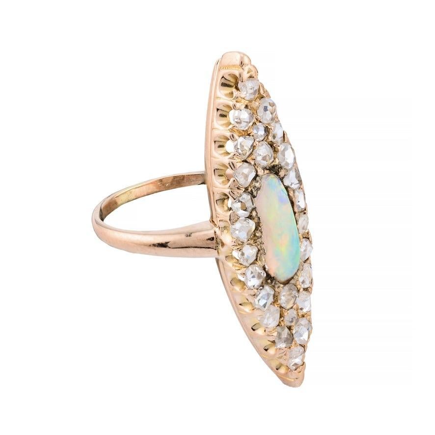 Aston Estate Jewelry Presents:

A striking statement ring featuring a 1.3 carat cabochon cut natural black opal. Surrounded by 1.05 carats of rose cut diamonds. Diamonds are of SI1 clarity and H color grade. The opal displays a striking play of