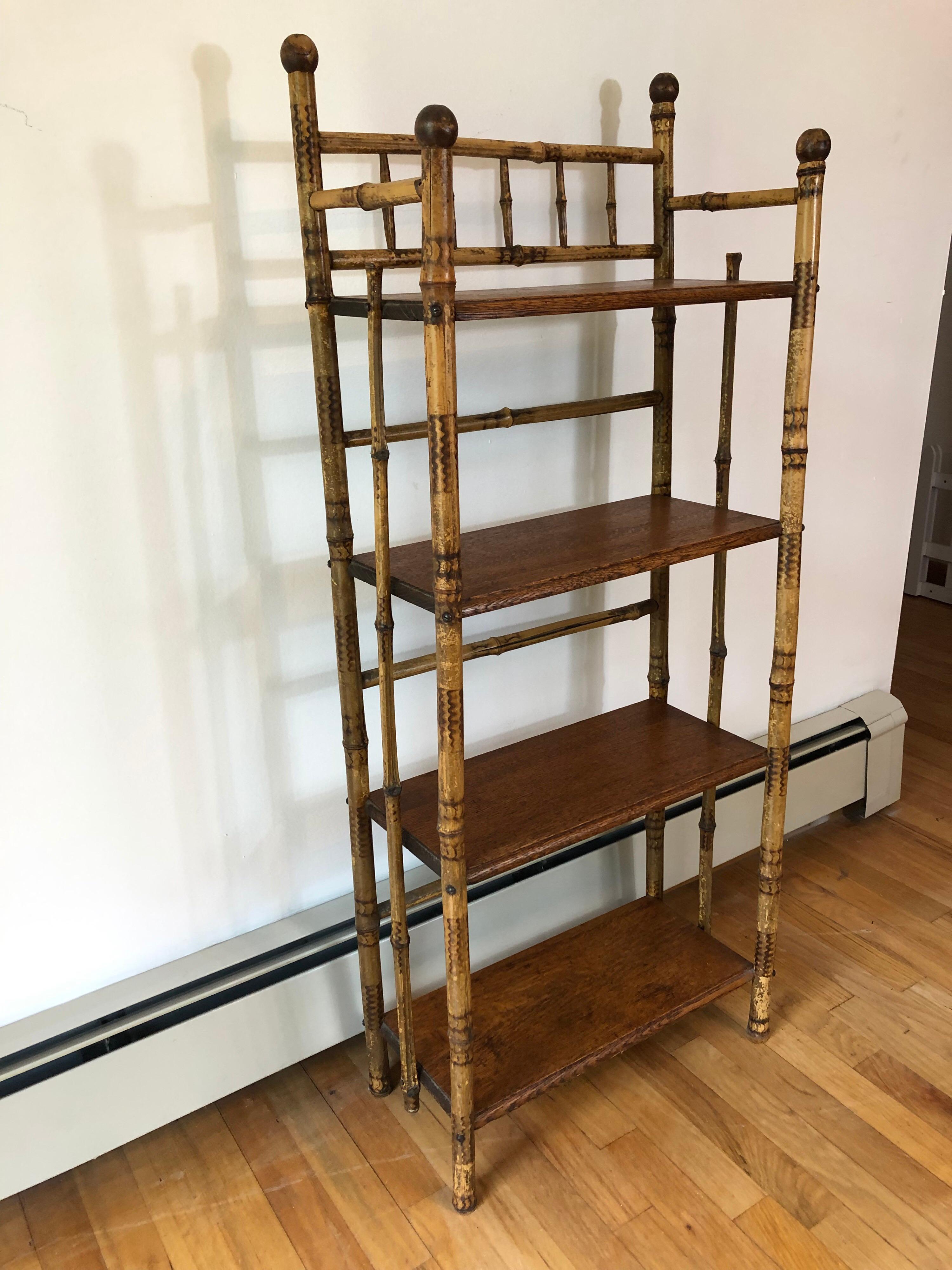 A late 19th century English lacquered bamboo and wood étagère. Consisting of four shelves.